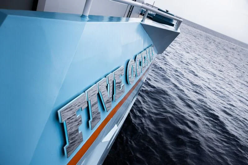 a large ship in the water aboard FIVE OCEANS Yacht for Sale