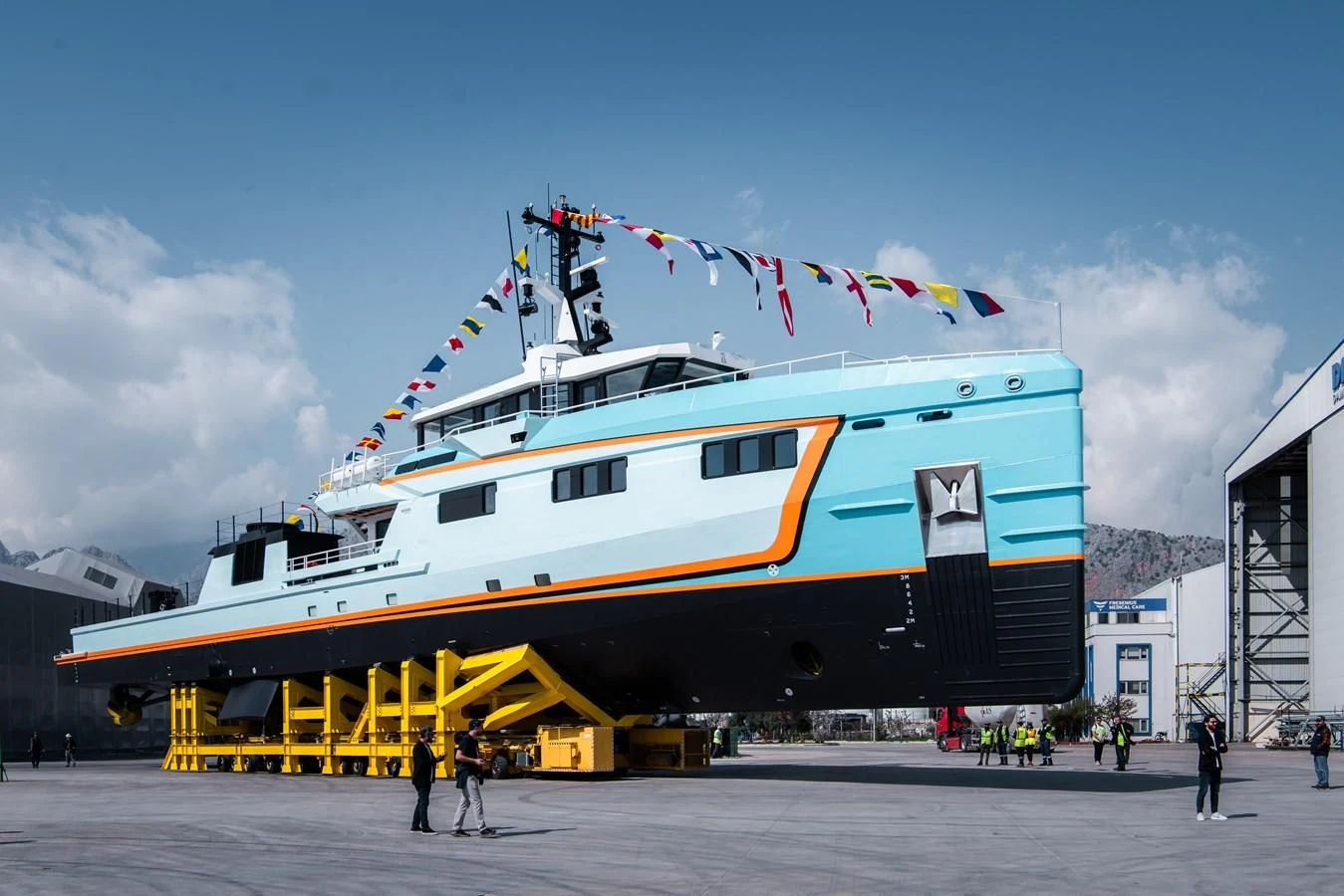 a large boat on a dock aboard FIVE OCEANS Yacht for Sale