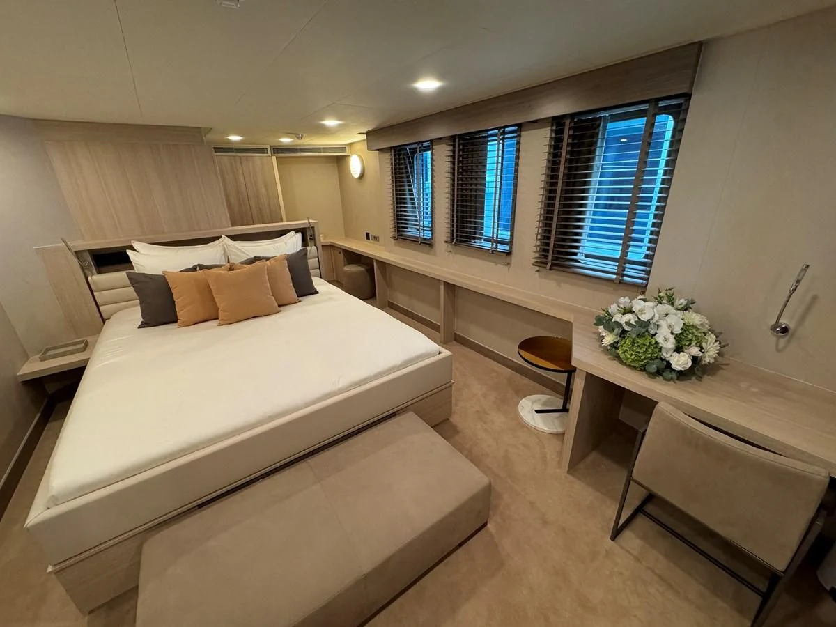 a hotel room with two beds aboard FIVE OCEANS Yacht for Sale