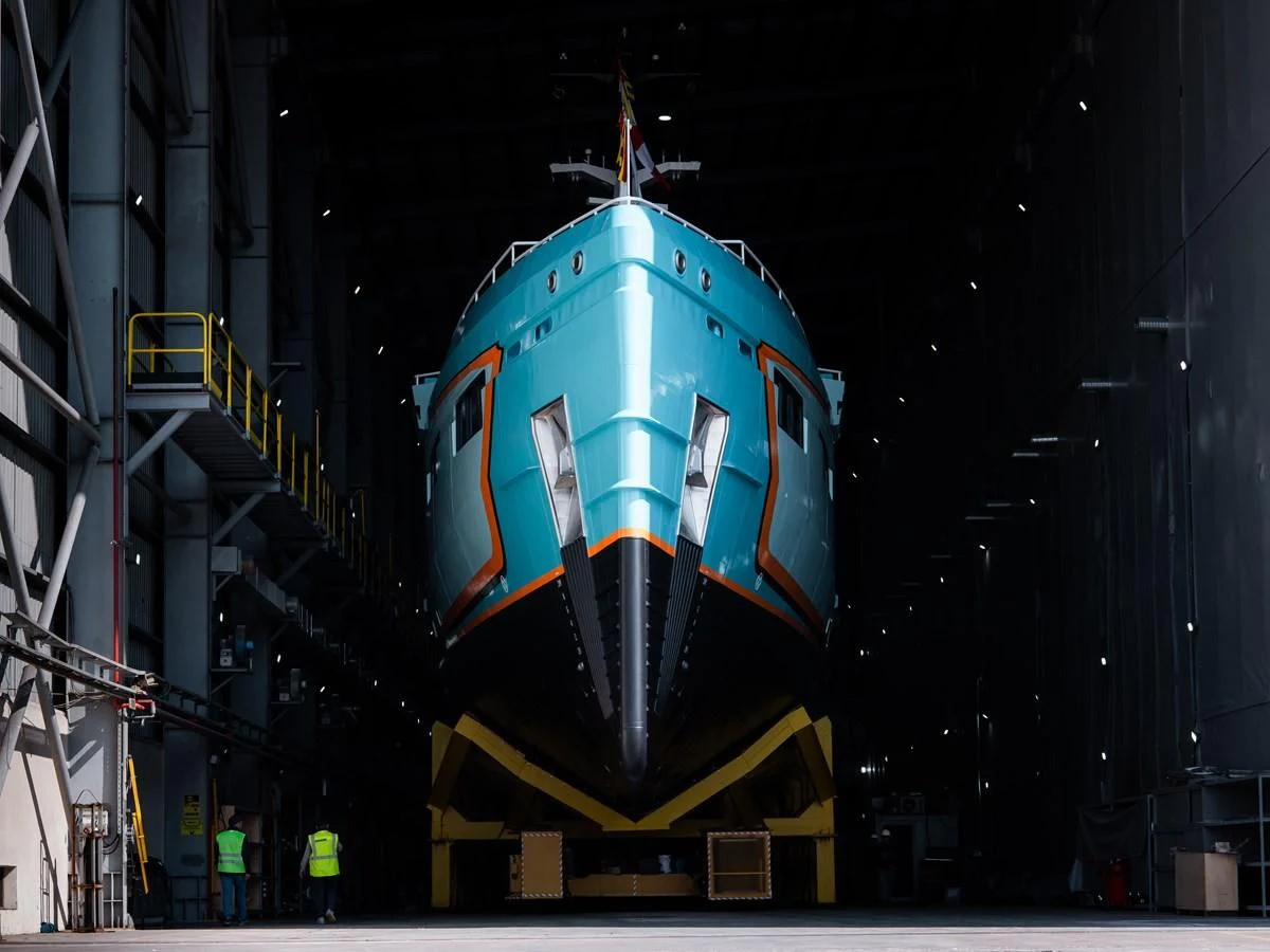 a blue and red object with a white top and yellow lights aboard FIVE OCEANS Yacht for Sale
