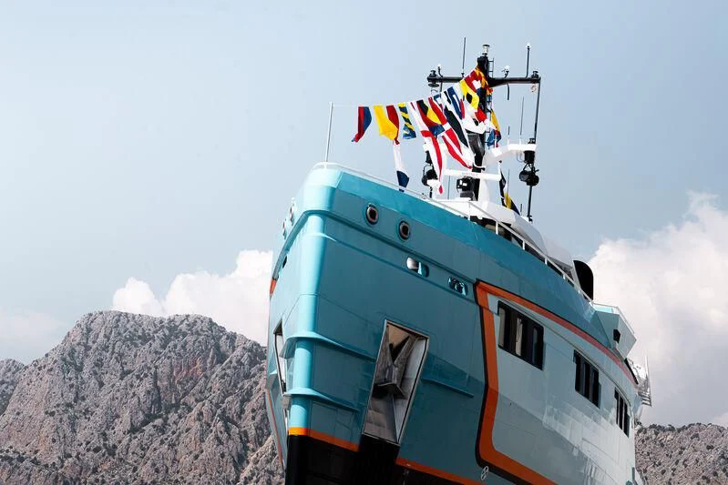 a boat with flags on it aboard FIVE OCEANS Yacht for Sale