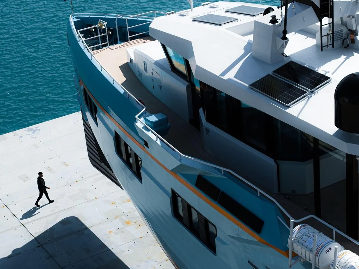 a large ship docked aboard FIVE OCEANS Yacht for Sale