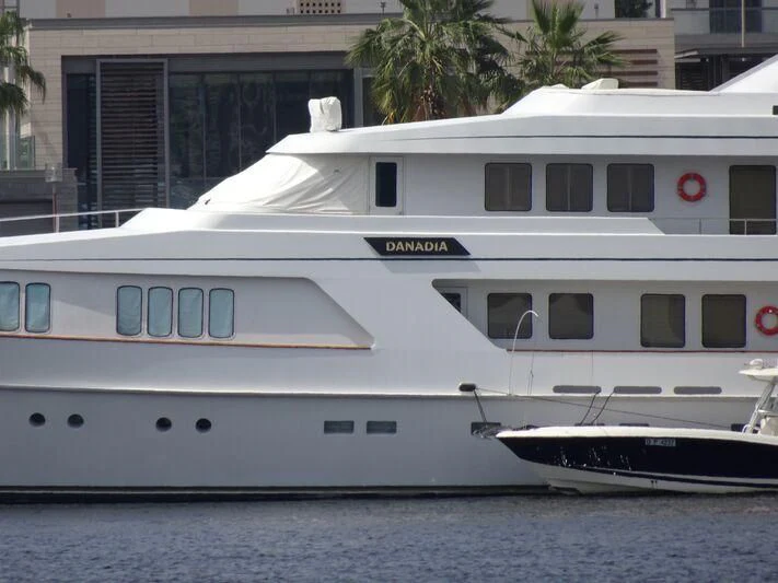 a white yacht in the water aboard DANADIA Yacht for Sale