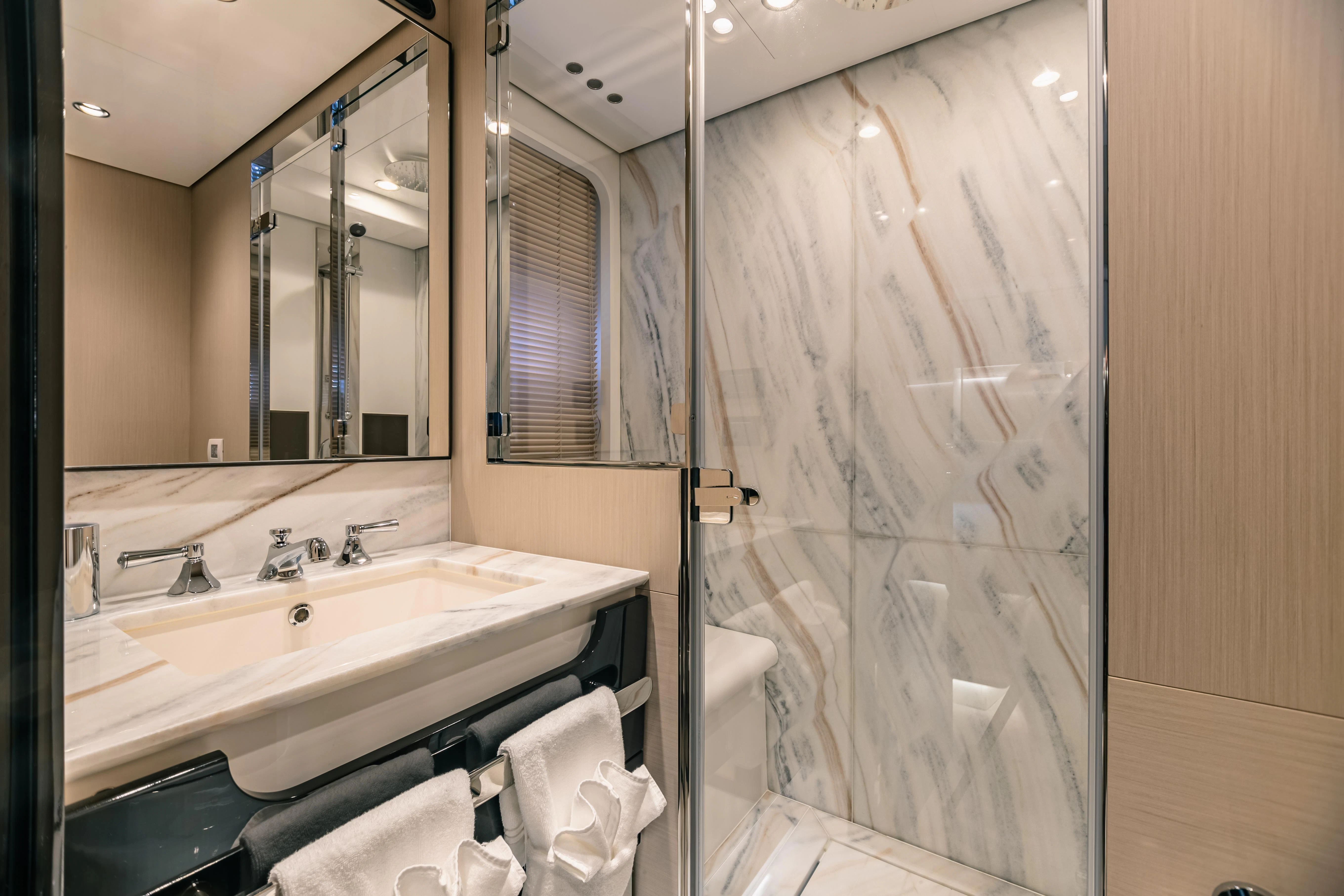a bathroom with a glass shower aboard MAREA LA NAUTICA Yacht for Sale