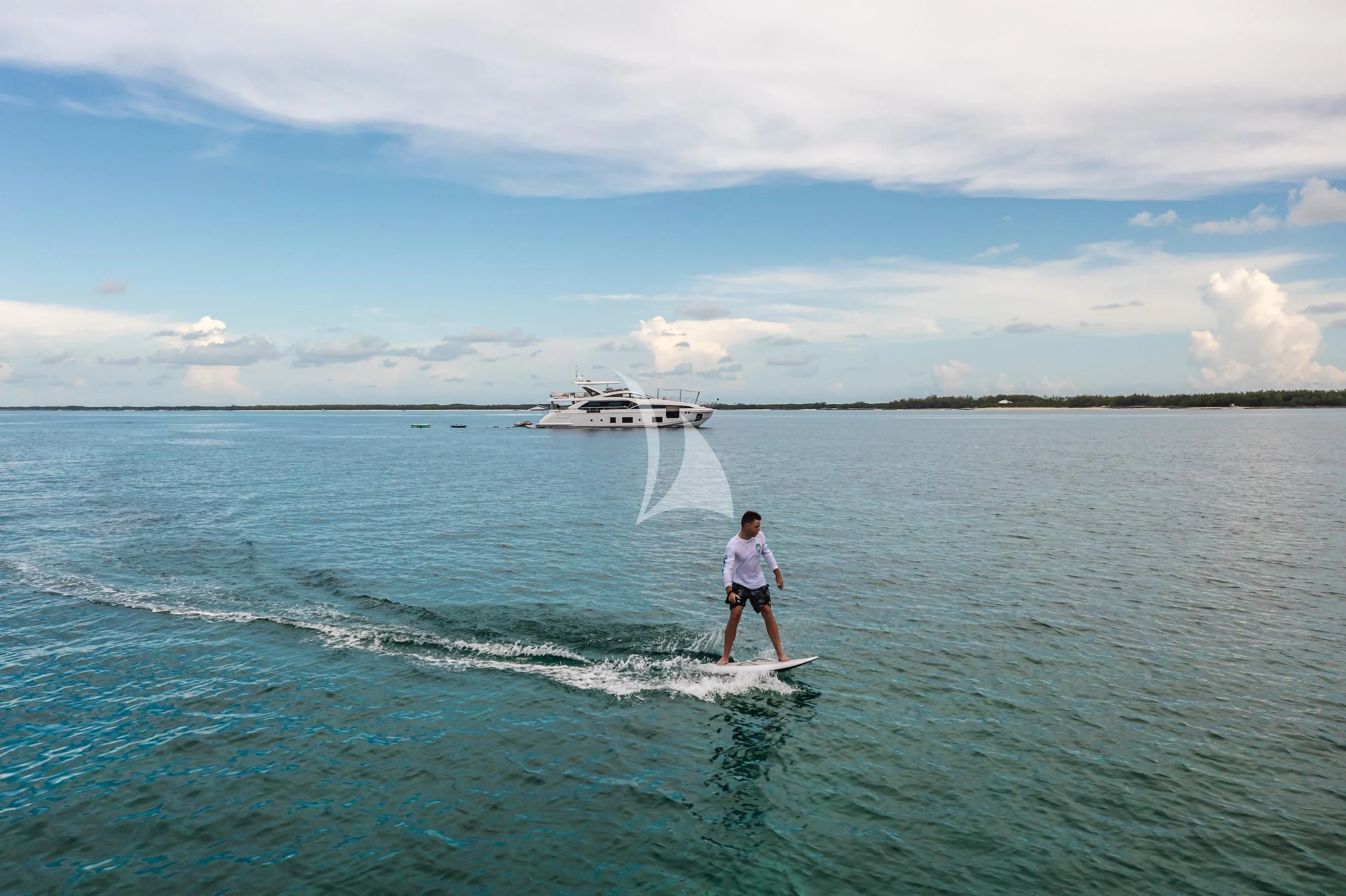 a man surfing on the sea aboard MAREA LA NAUTICA Yacht for Sale