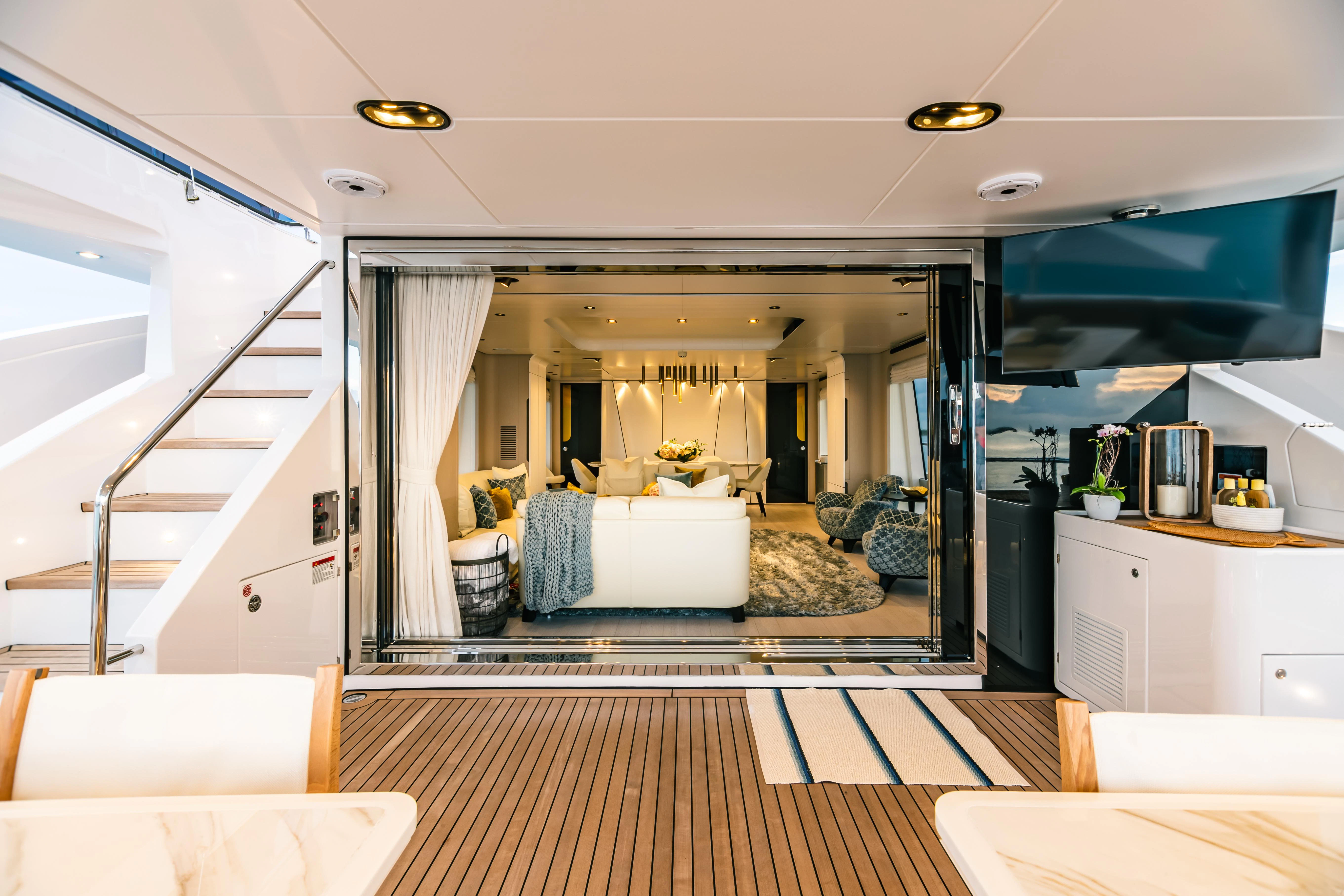a living room with a large open door aboard MAREA LA NAUTICA Yacht for Sale