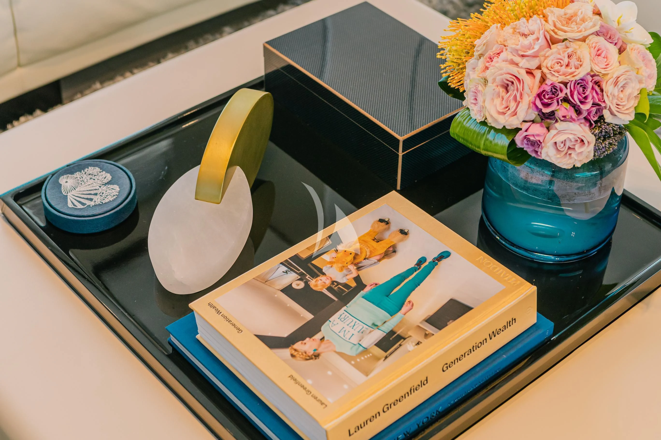 a desk with a book and flowers aboard MAREA LA NAUTICA Yacht for Sale