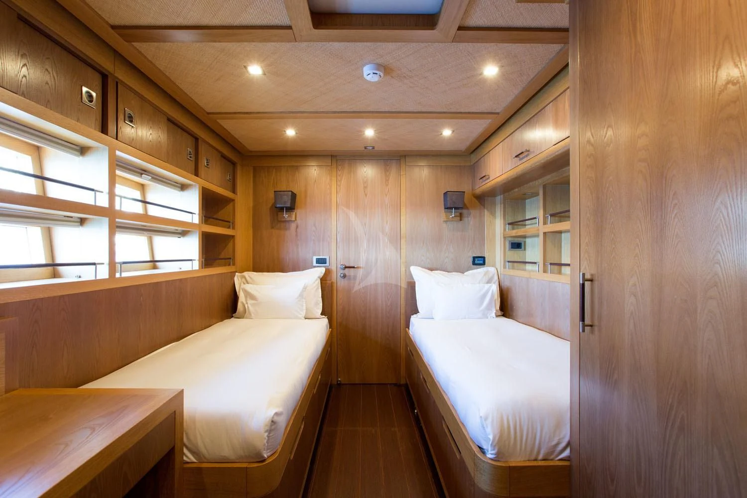 a room with a bed and a wood wall aboard MASHUA BLUU Yacht for Sale
