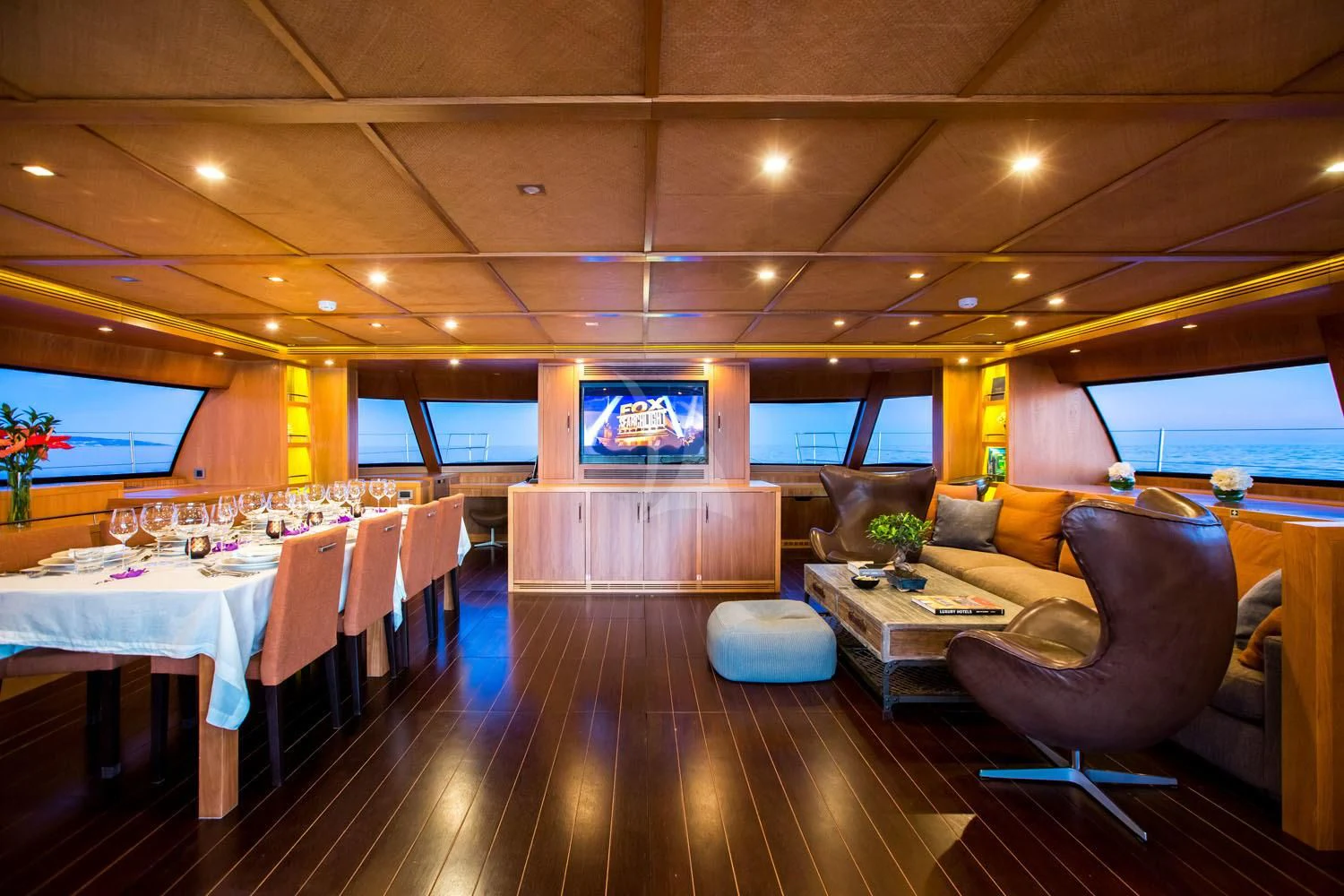 a large room with tables and chairs aboard MASHUA BLUU Yacht for Sale