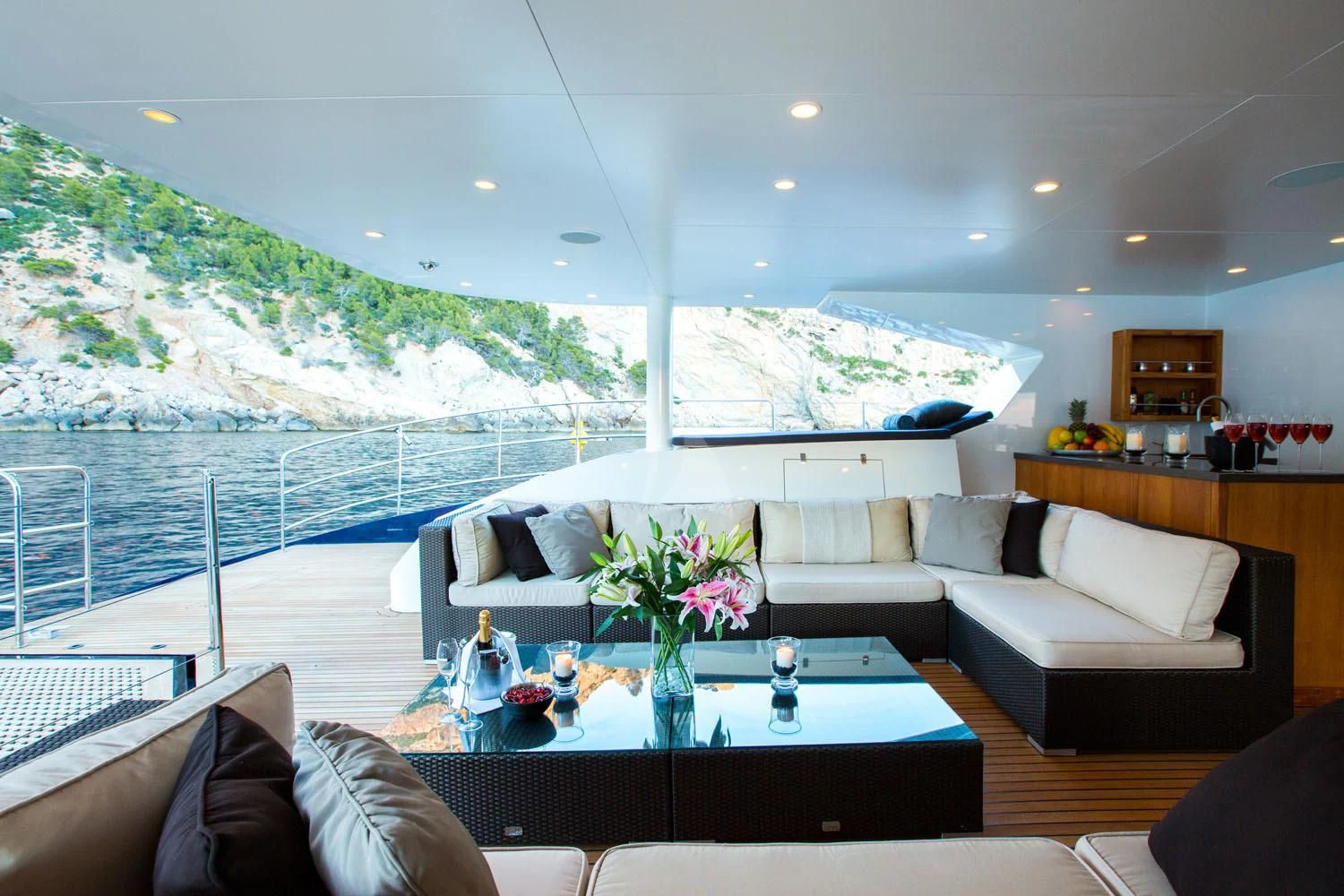 a living room with a large balcony aboard MASHUA BLUU Yacht for Sale