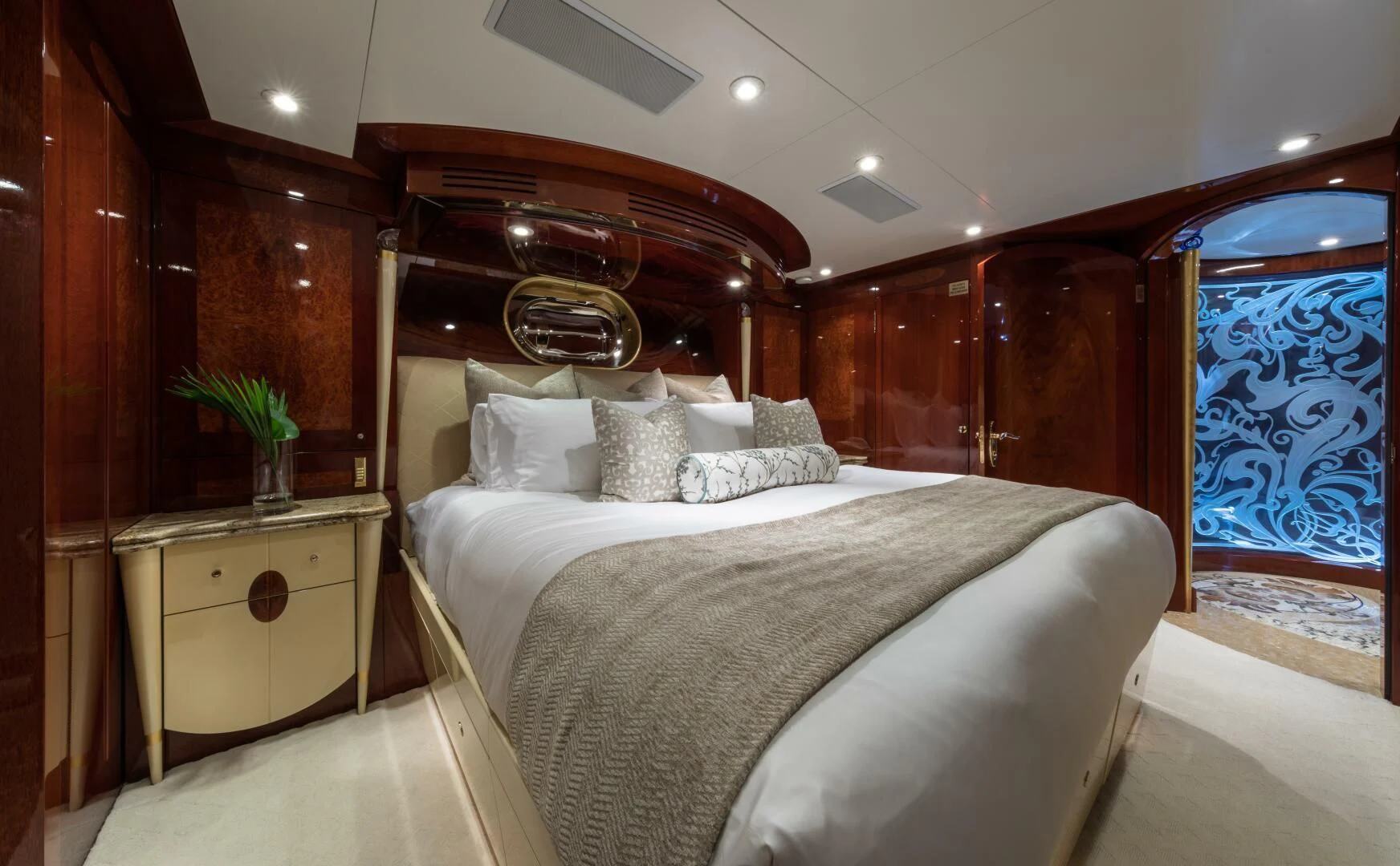 a bed with a white bed spread aboard TOUCH Yacht for Sale