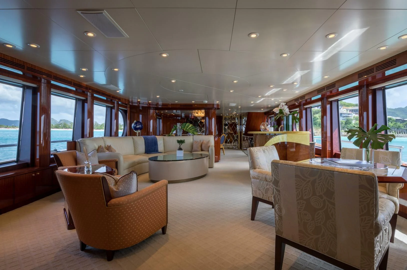 a living room with a table and chairs aboard TOUCH Yacht for Sale