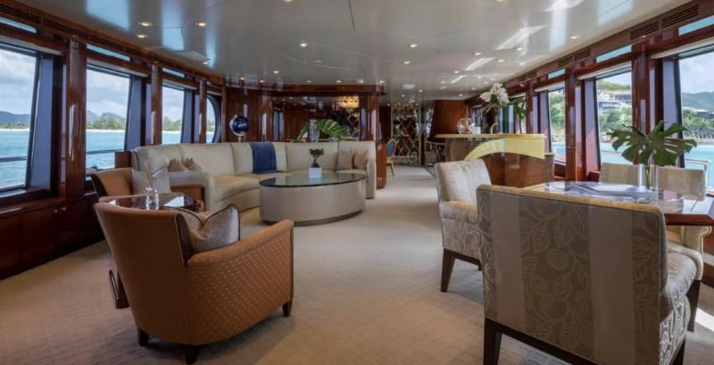a living room with a couch and a table aboard TOUCH Yacht for Sale