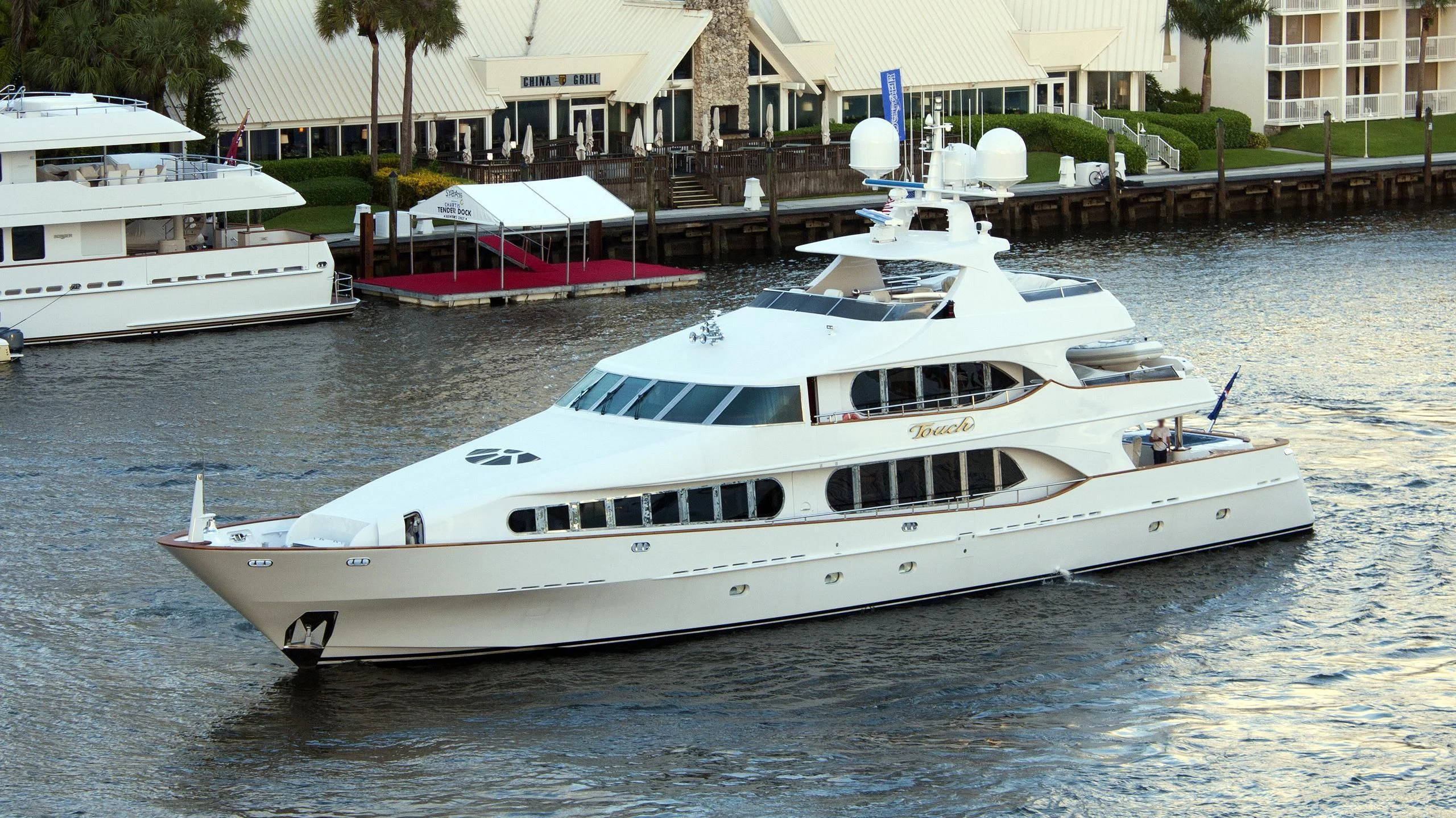 a white yacht in the water aboard TOUCH Yacht for Sale