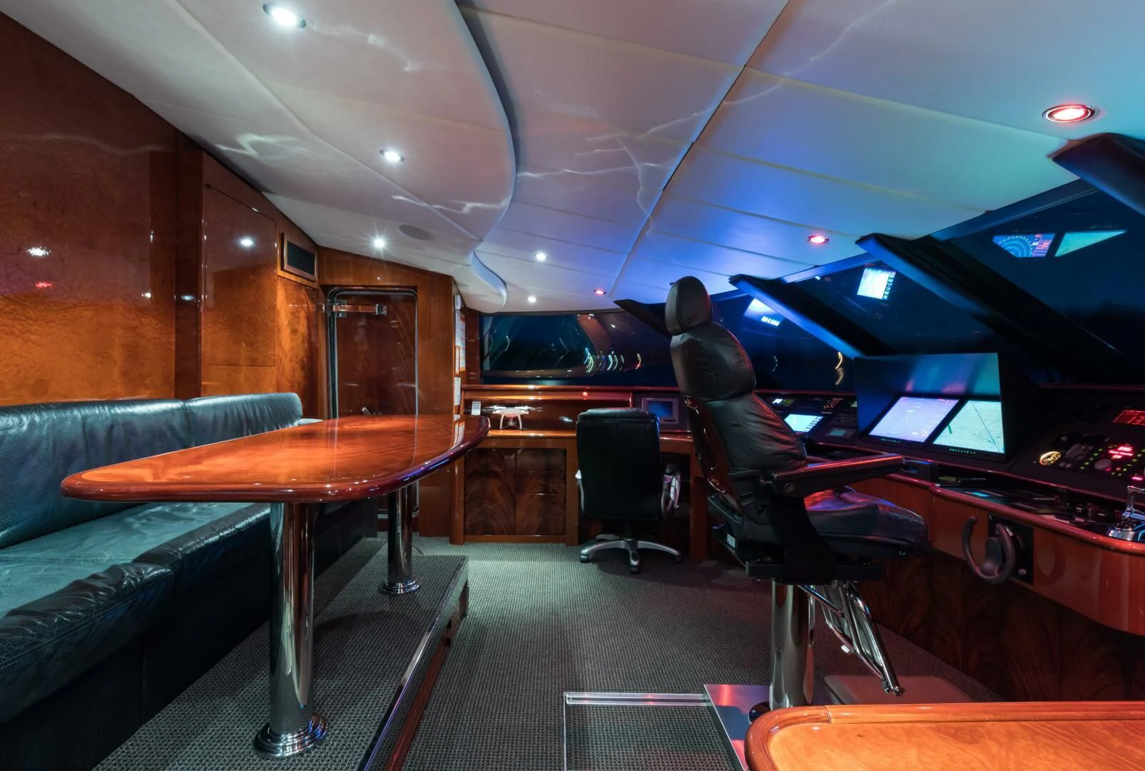 a room with a table and chairs aboard TOUCH Yacht for Sale