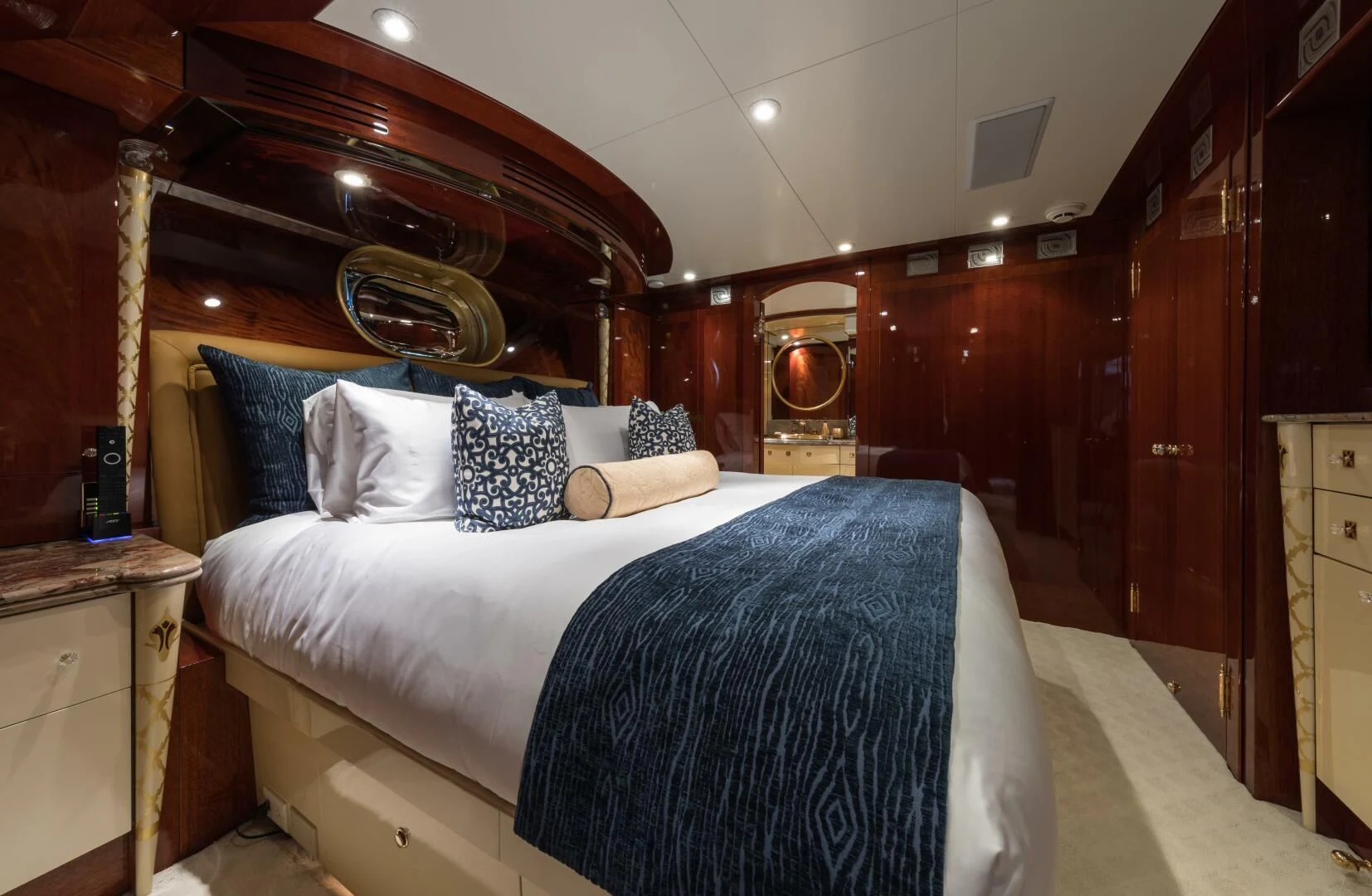a bed with blue sheets aboard TOUCH Yacht for Sale