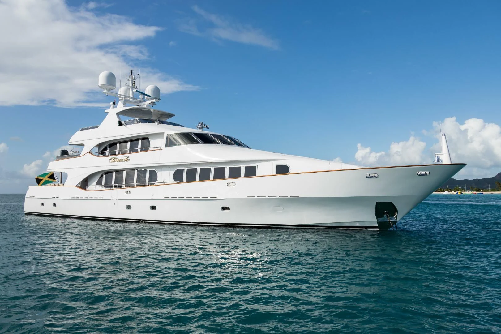 a white yacht in the water aboard TOUCH Yacht for Sale