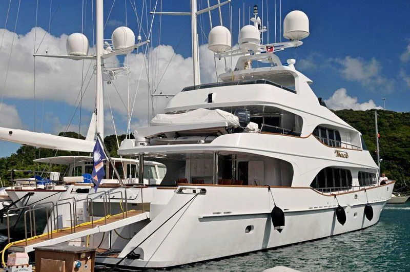 a white yacht in the water aboard TOUCH Yacht for Sale