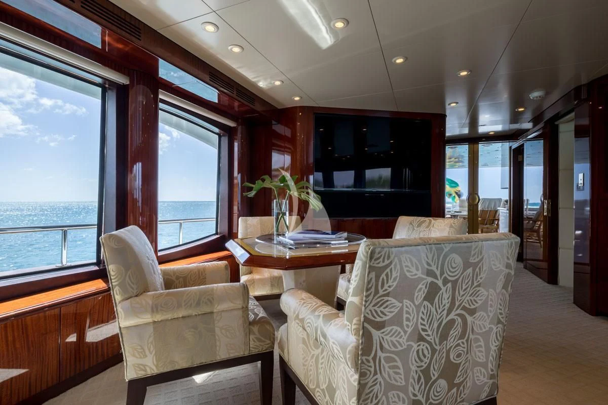 a room with a table and chairs aboard TOUCH Yacht for Sale