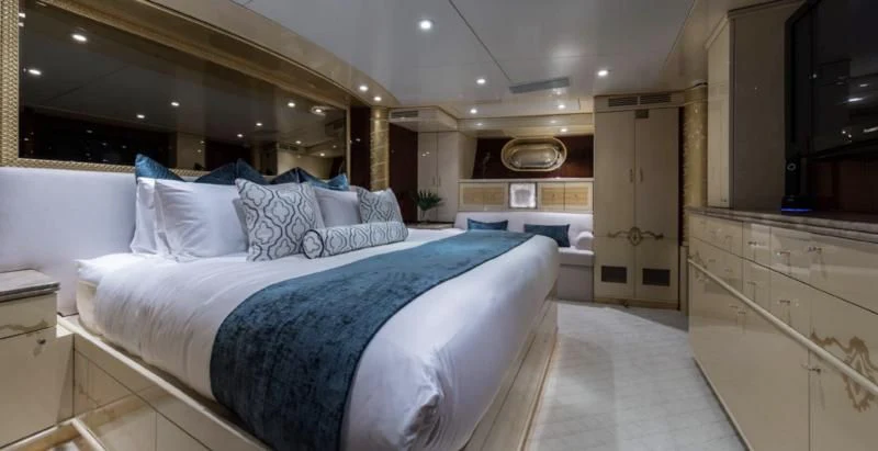 a large bedroom with a large bed aboard TOUCH Yacht for Sale
