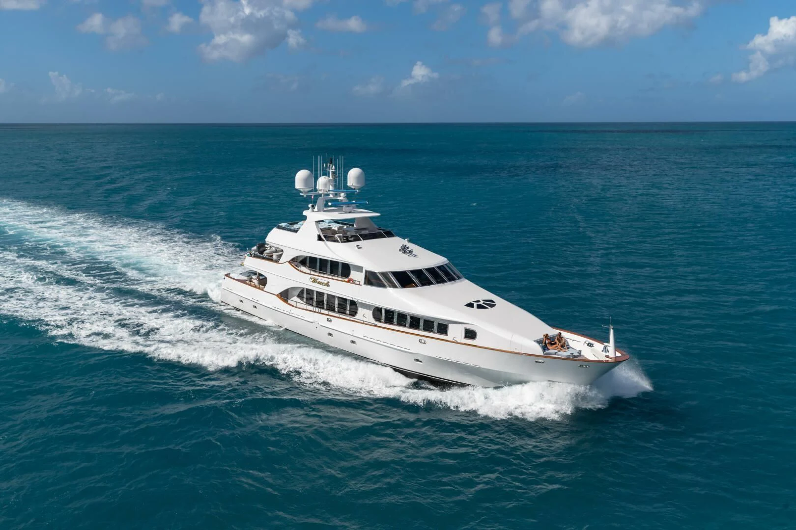 a white yacht on the water aboard TOUCH Yacht for Sale