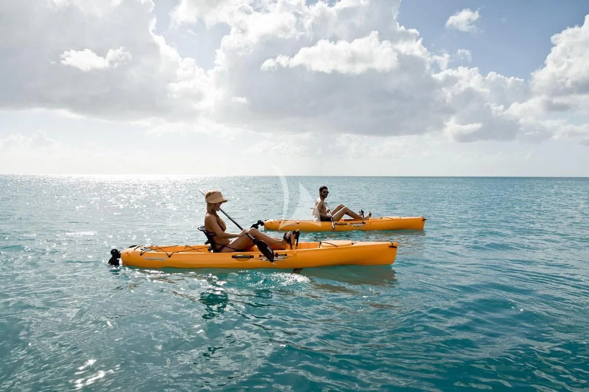 a group of people in a canoe aboard TOUCH Yacht for Sale