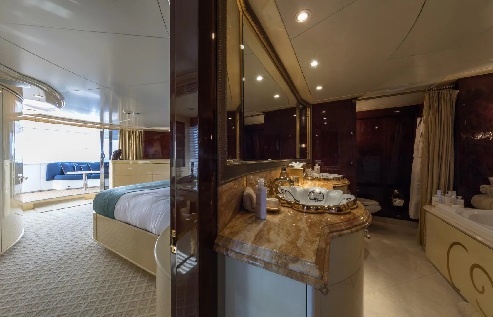 a large bathroom with a large mirror aboard TOUCH Yacht for Sale