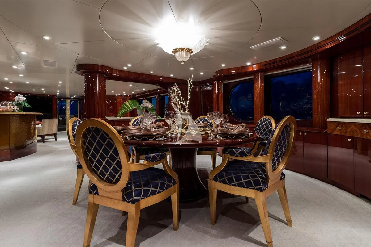 a dining room with a table and chairs aboard TOUCH Yacht for Sale