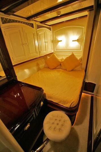 a small bedroom with a bed aboard ATREVIDA Yacht for Sale