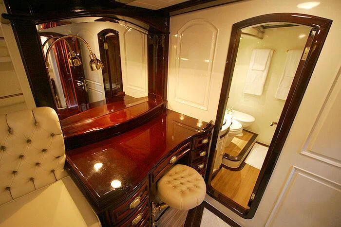 a room with a mirror and a bed aboard ATREVIDA Yacht for Sale