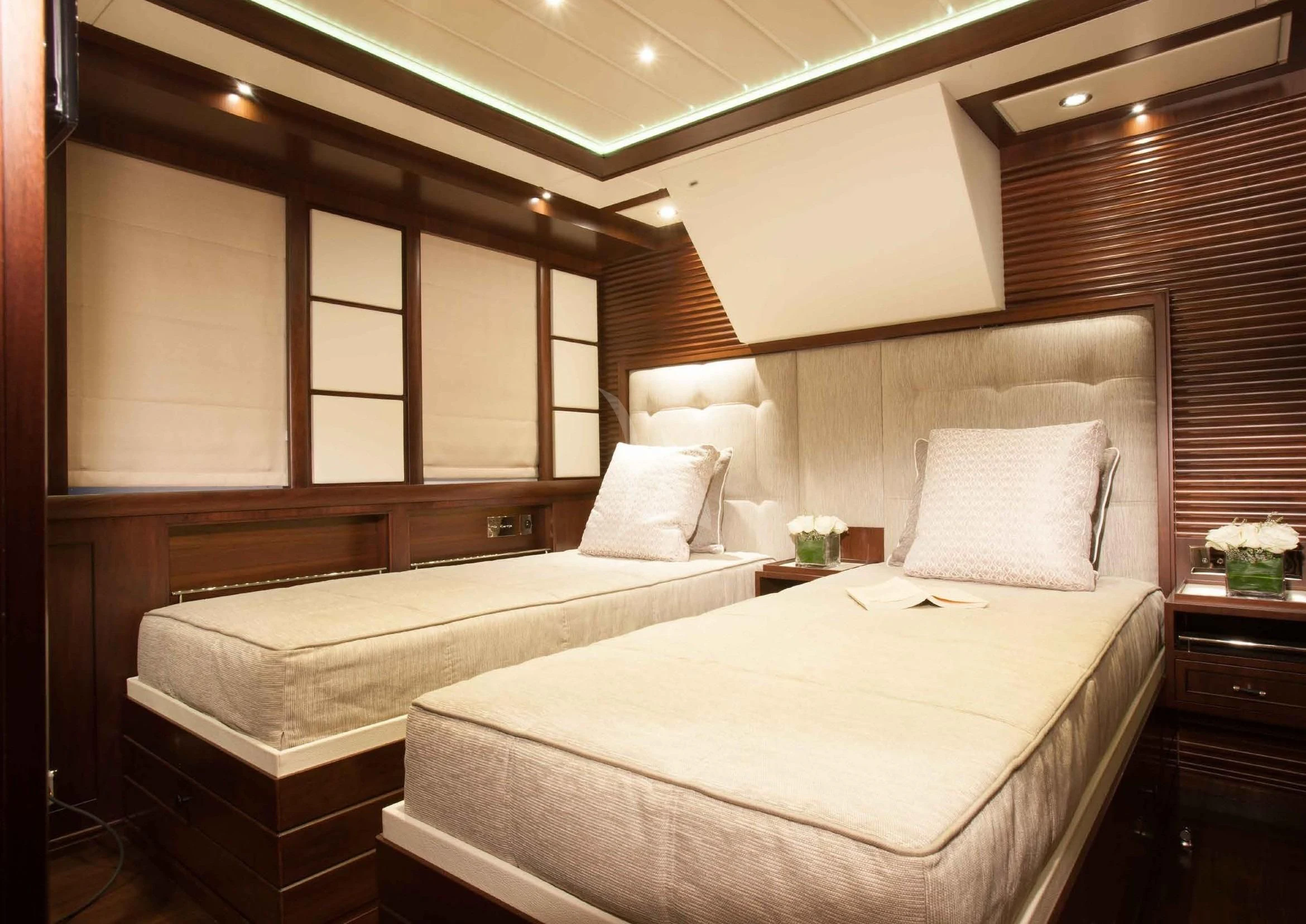 a room with two beds aboard ICE LADY Yacht for Sale