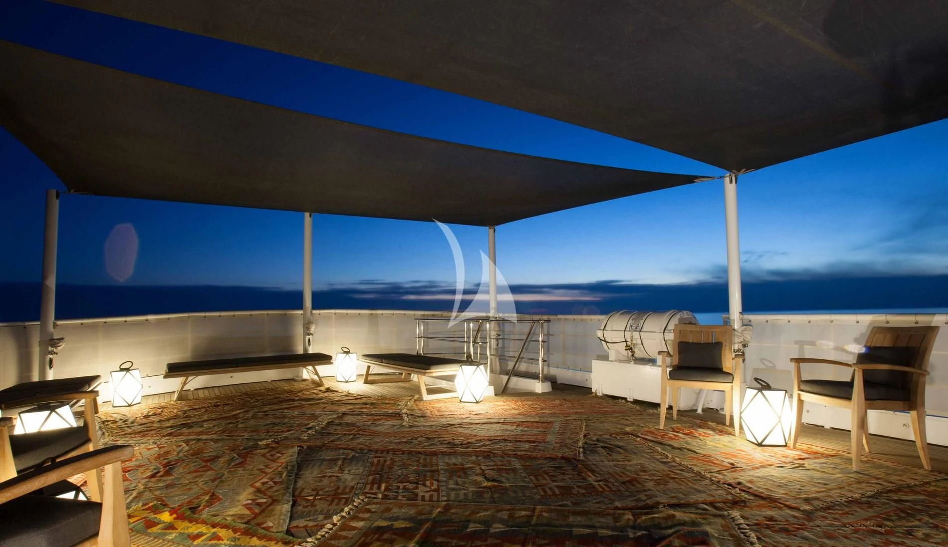 a patio with a table and chairs aboard ICE LADY Yacht for Sale