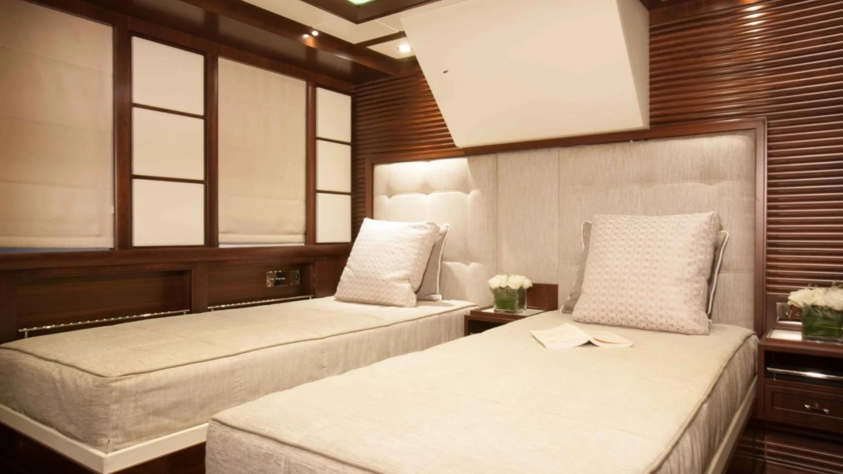 a room with two beds aboard ICE LADY Yacht for Sale