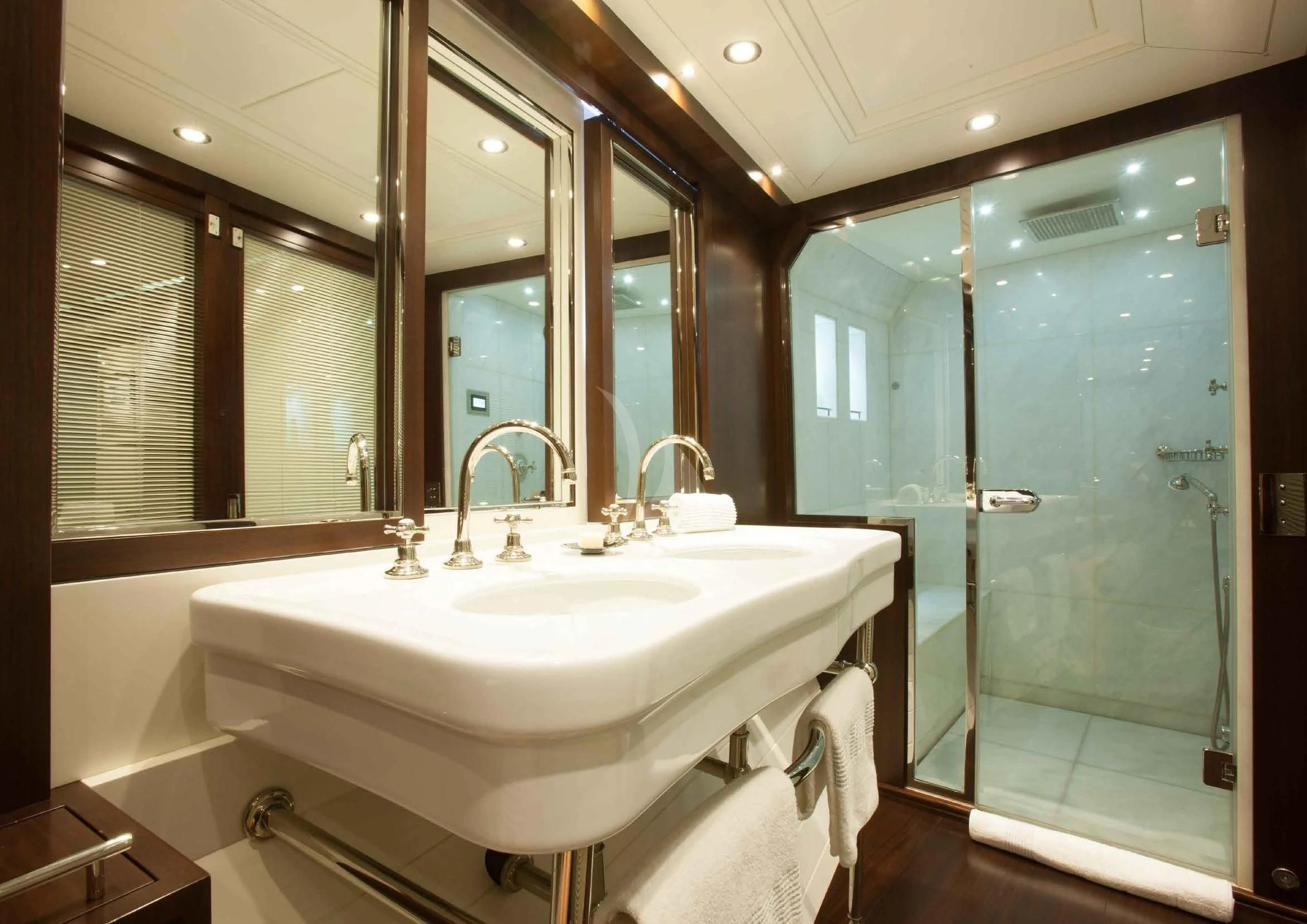 a bathroom with a sink and a shower aboard ICE LADY Yacht for Sale