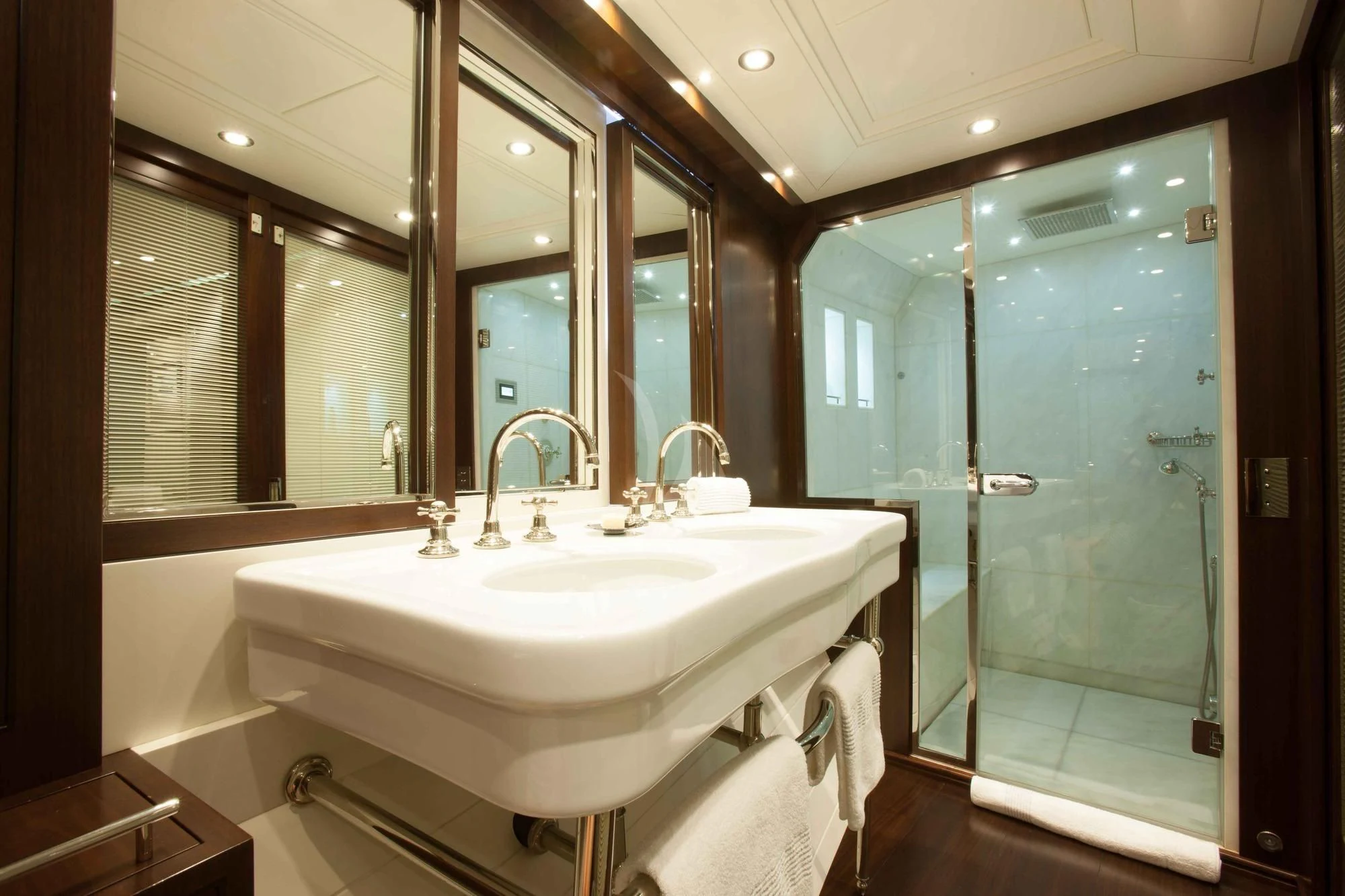 a bathroom with a sink and a shower aboard ICE LADY Yacht for Sale