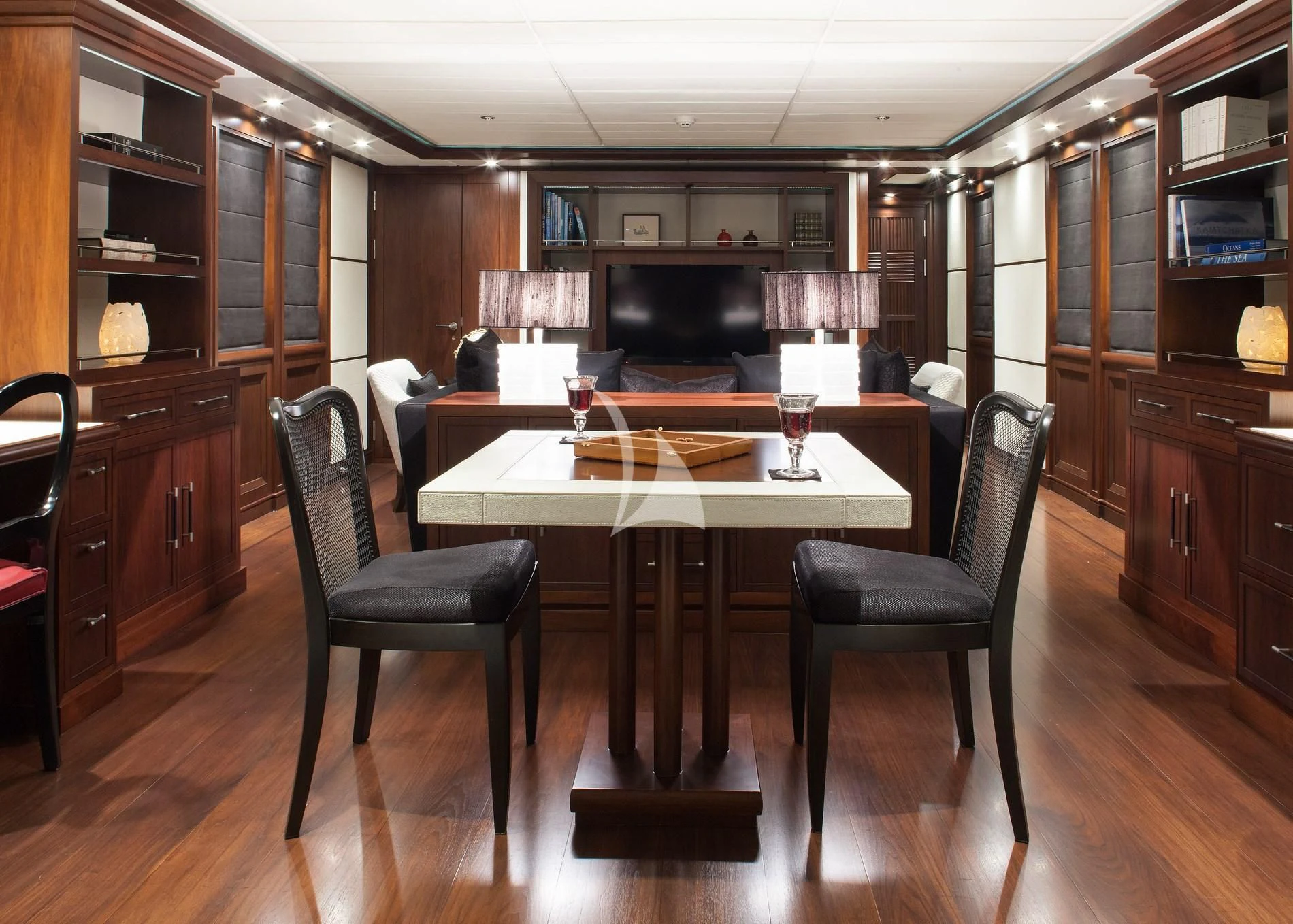 a table and chairs in a room aboard ICE LADY Yacht for Sale