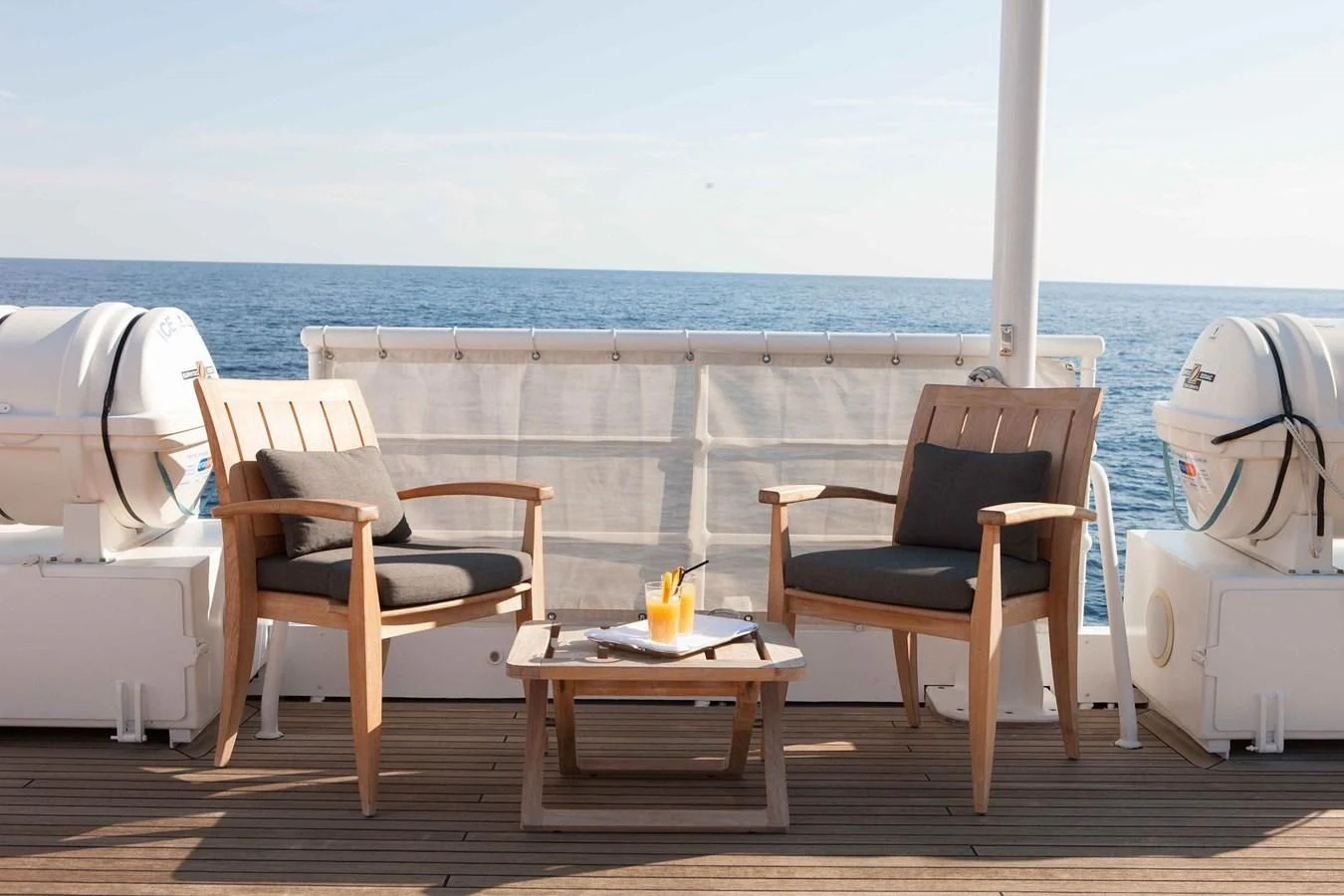 chairs and tables on a deck aboard ICE LADY Yacht for Sale