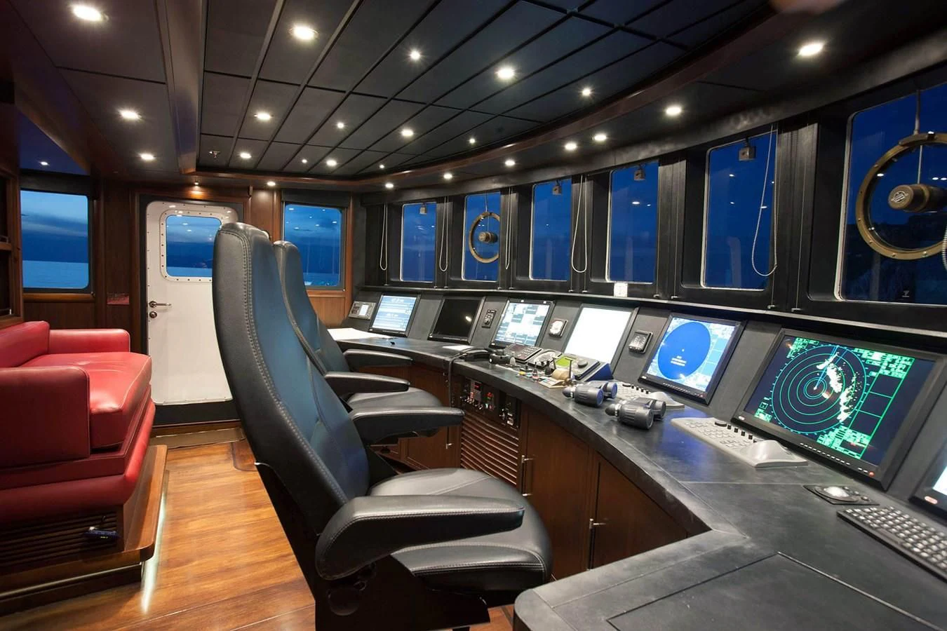 a room with a desk and chairs aboard ICE LADY Yacht for Sale