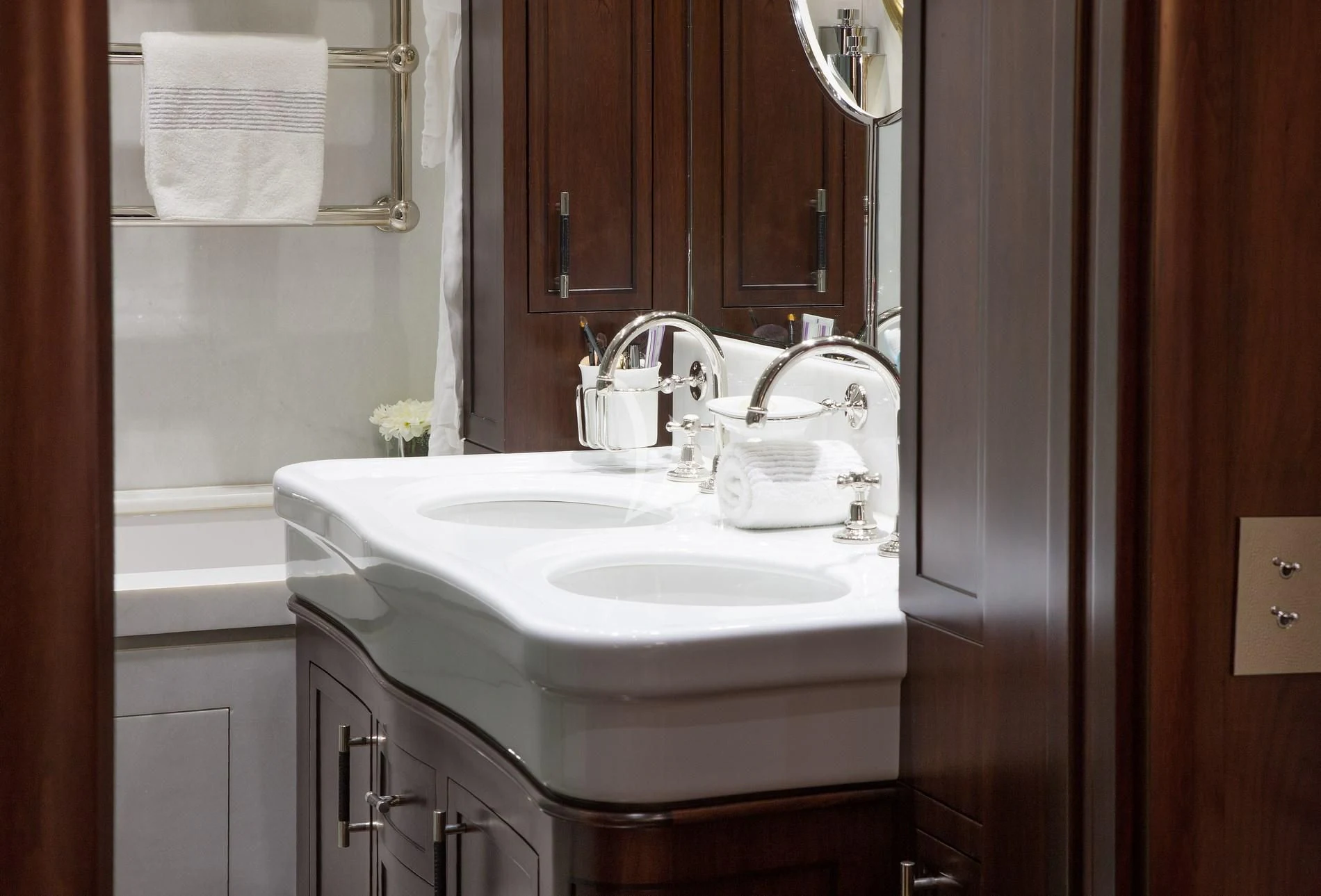 a bathroom with a sink and a mirror aboard ICE LADY Yacht for Sale