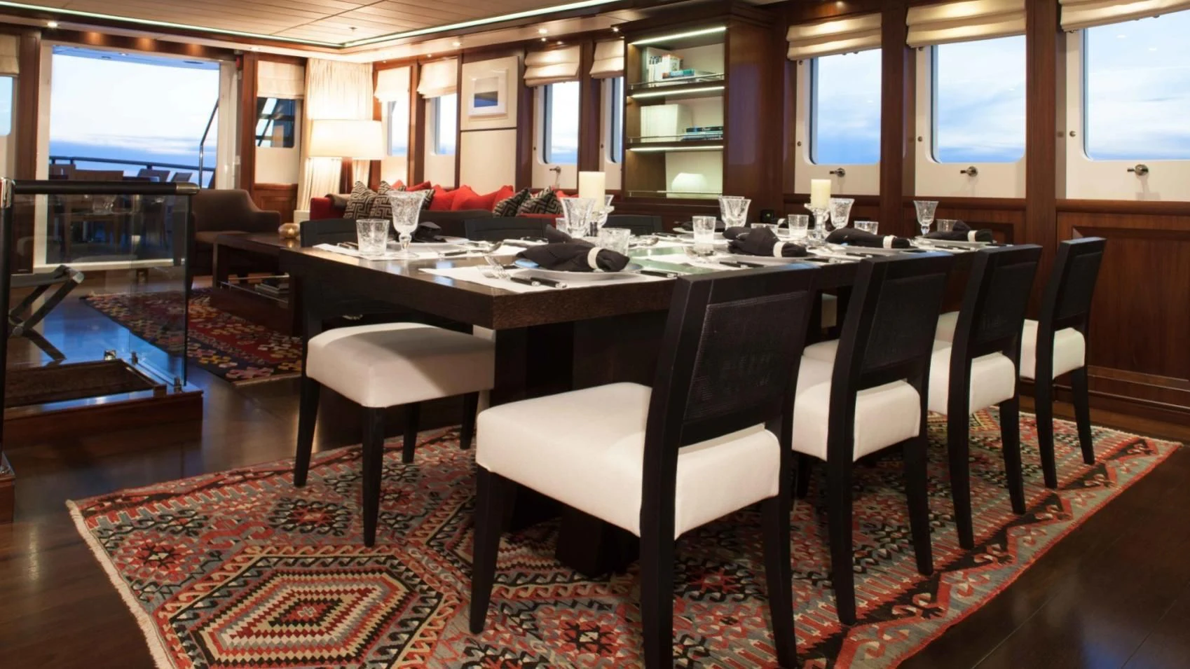 a large dining table in a room aboard ICE LADY Yacht for Sale