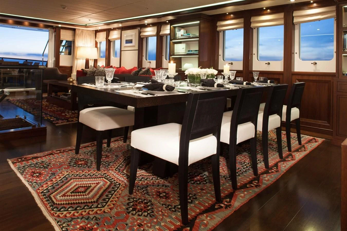 a large dining table with a large screen aboard ICE LADY Yacht for Sale