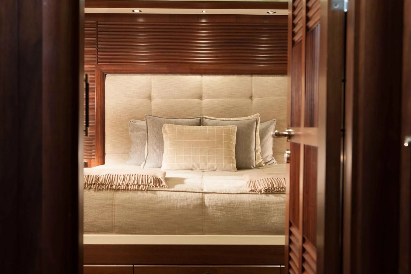 a bed with pillows aboard ICE LADY Yacht for Sale