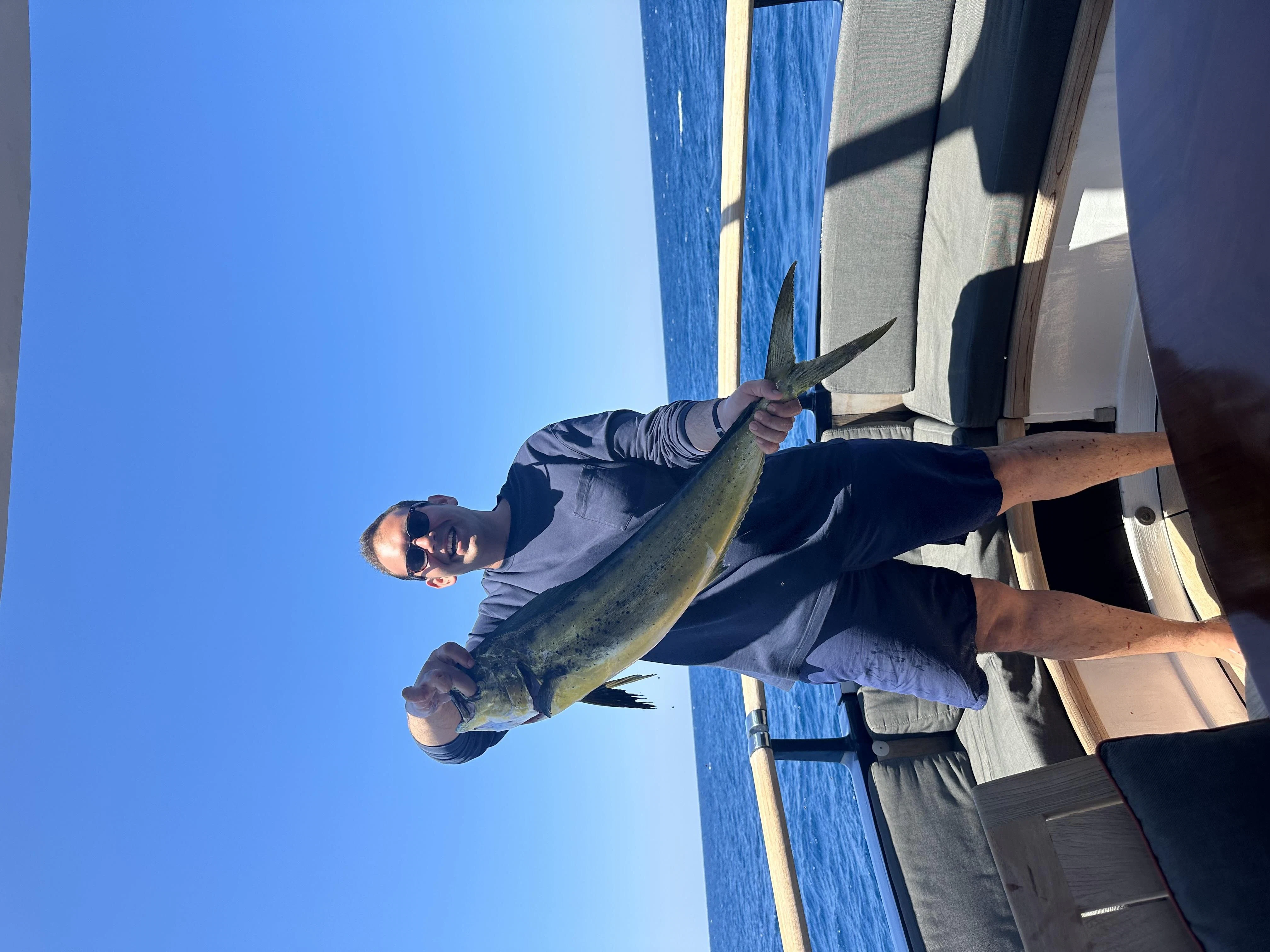 a man standing on a ladder aboard ICE LADY Yacht for Sale