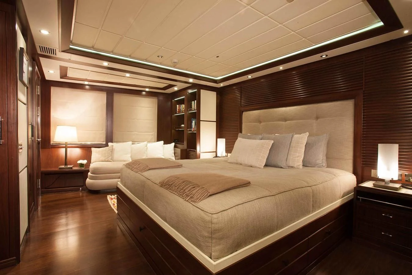 a large bedroom with a bed aboard ICE LADY Yacht for Sale