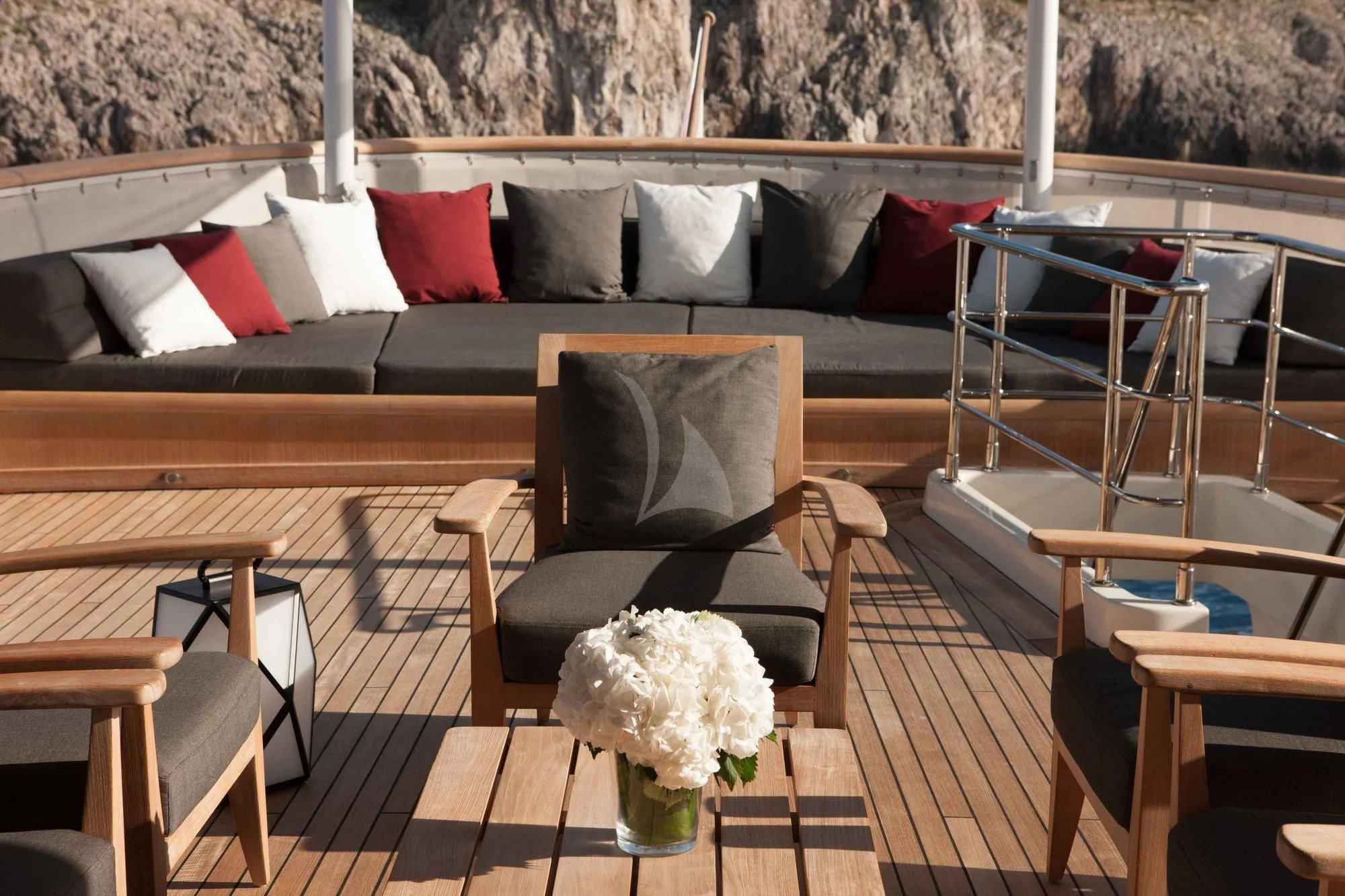 a black chair on a deck aboard ICE LADY Yacht for Sale