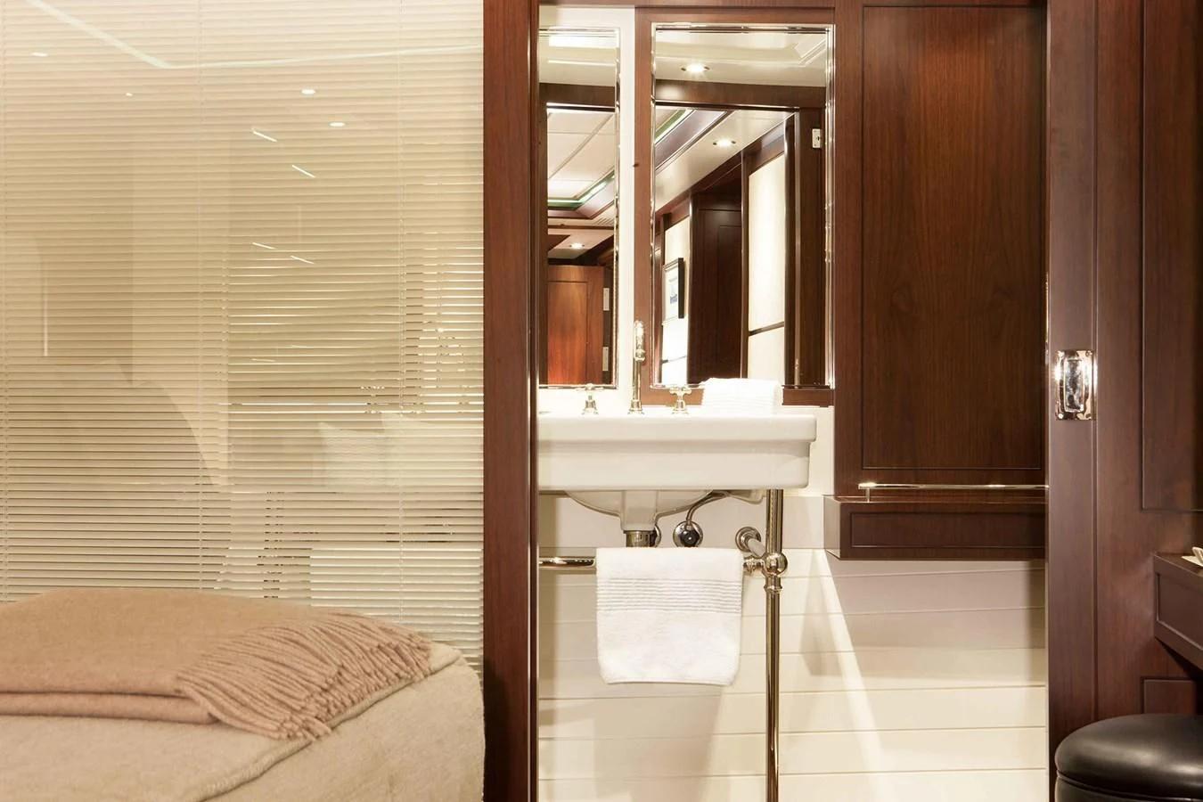 a bathroom with a sink and a mirror aboard ICE LADY Yacht for Sale