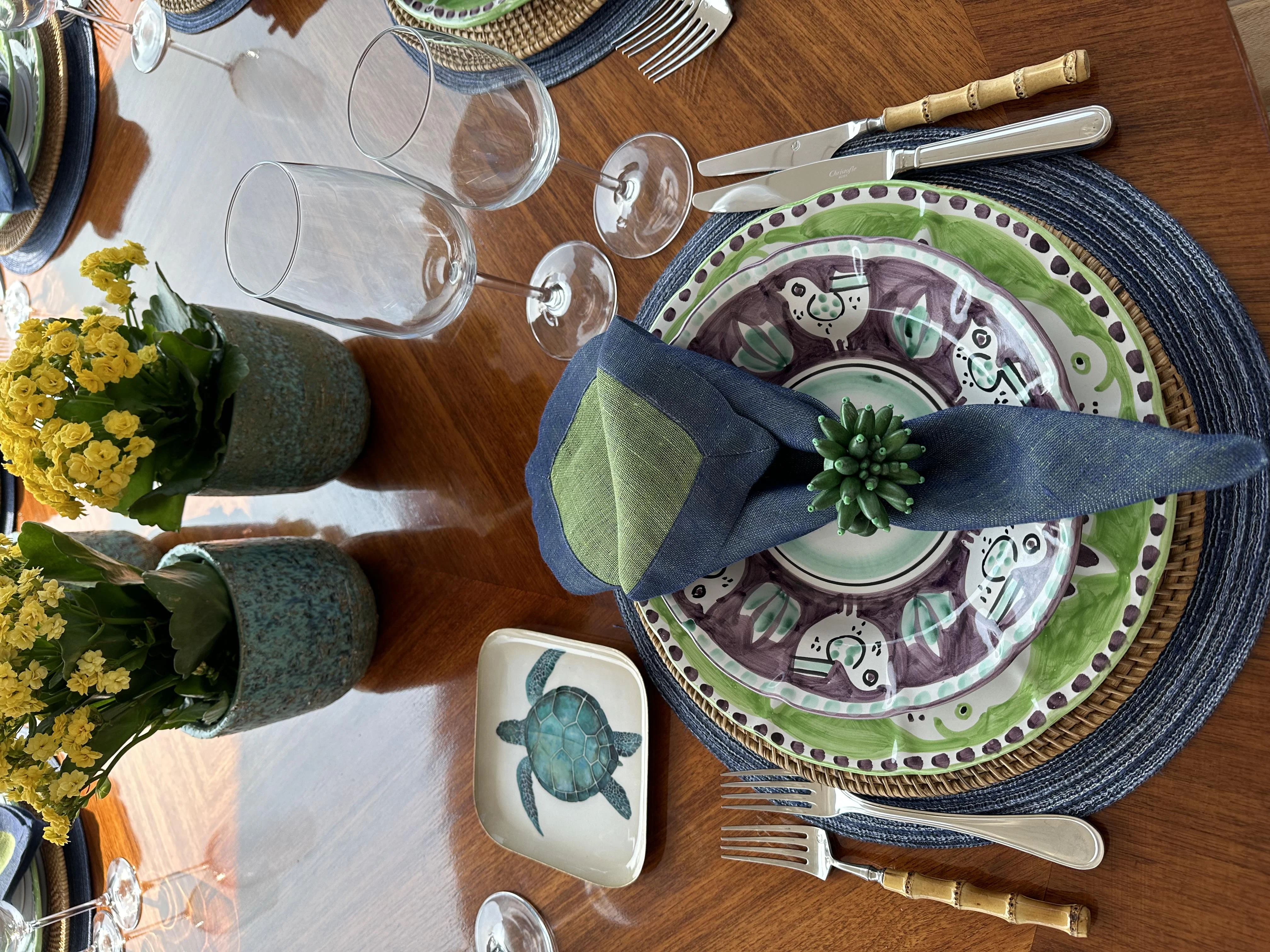 a plate with a flower and a plate with a knife and a knife aboard ICE LADY Yacht for Sale