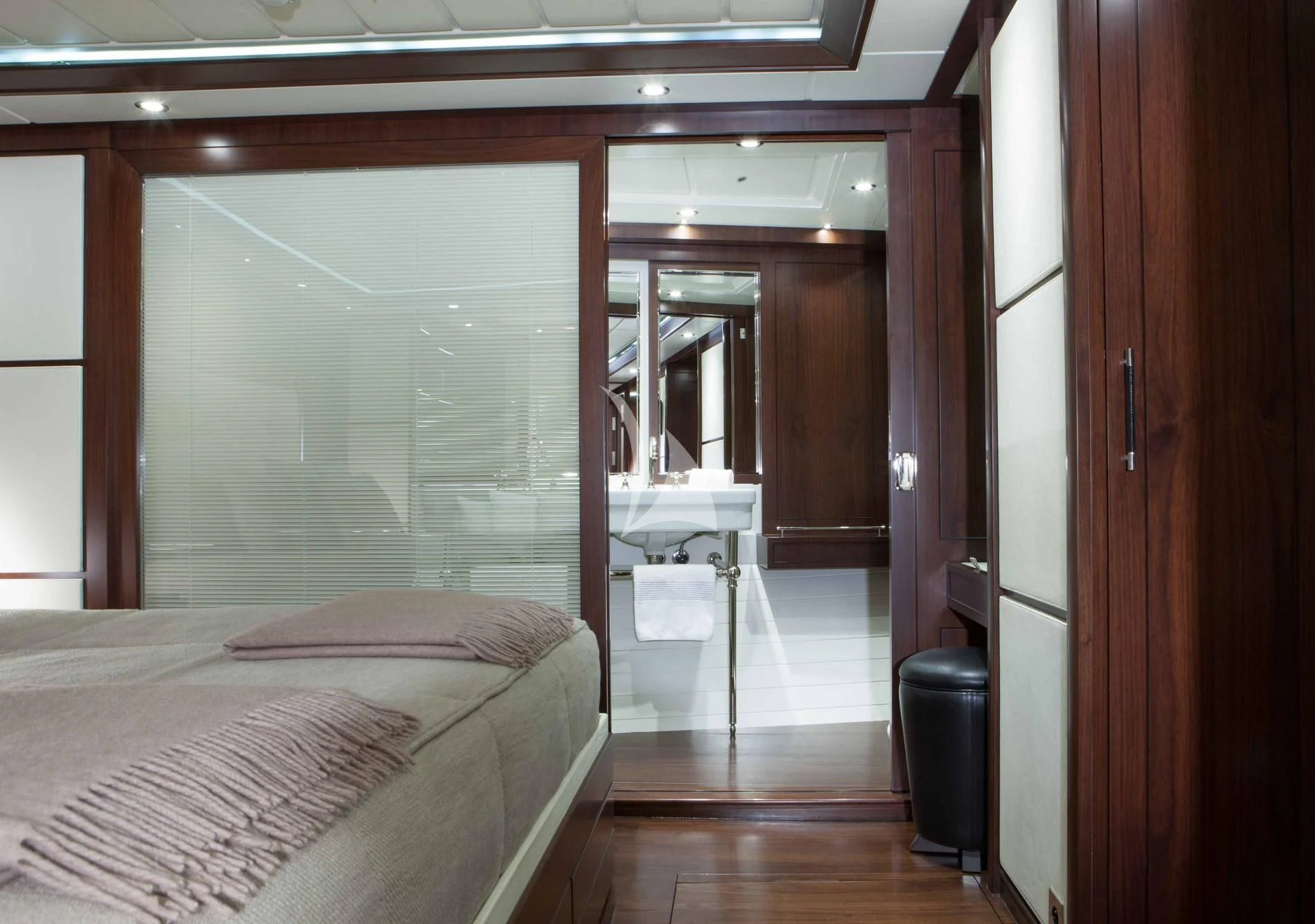 a room with a bed and a mirror aboard ICE LADY Yacht for Sale