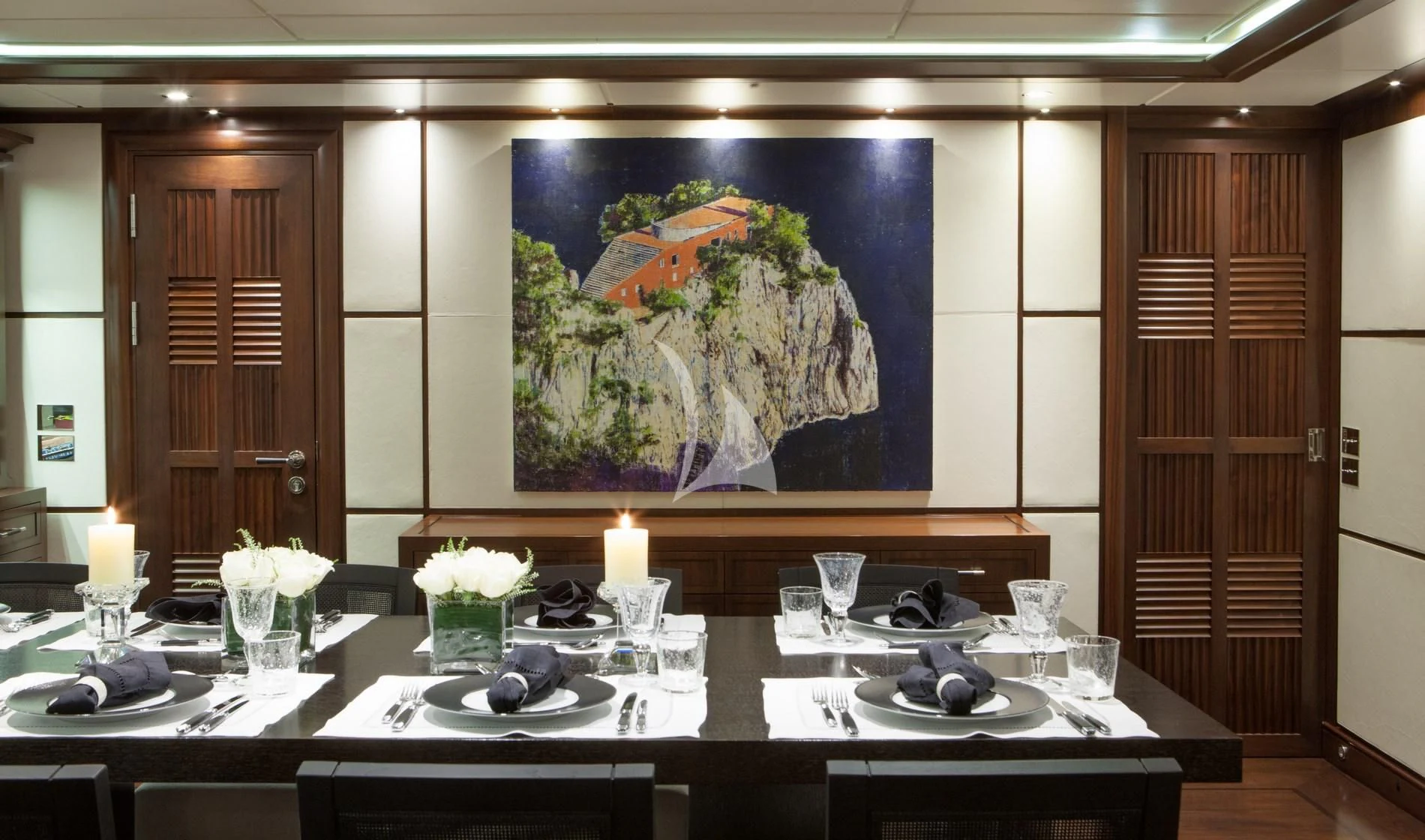 a table with plates and glasses on it aboard ICE LADY Yacht for Sale