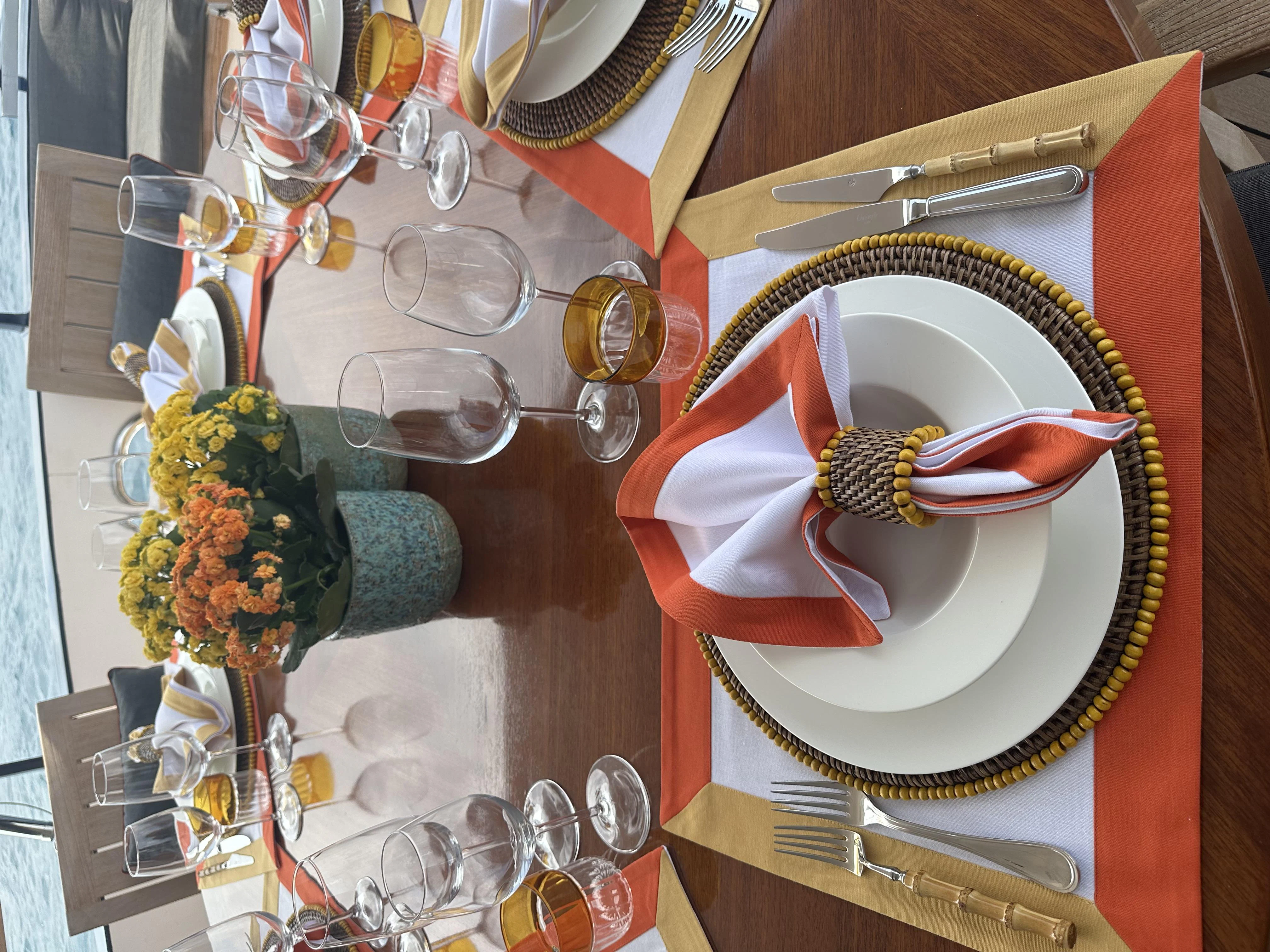 a table with plates and glasses aboard ICE LADY Yacht for Sale